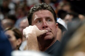 MIAMI - JANUARY 30:  Former Miami Dolphin quarterback Dan Marino watches the game between the Miami Heat and the Houston Rockets on January 30, 2005 at American Airlines Arena in Miami, Florida. The heat defeated the Rockets 104-95.  NOTE TO USER: User ex