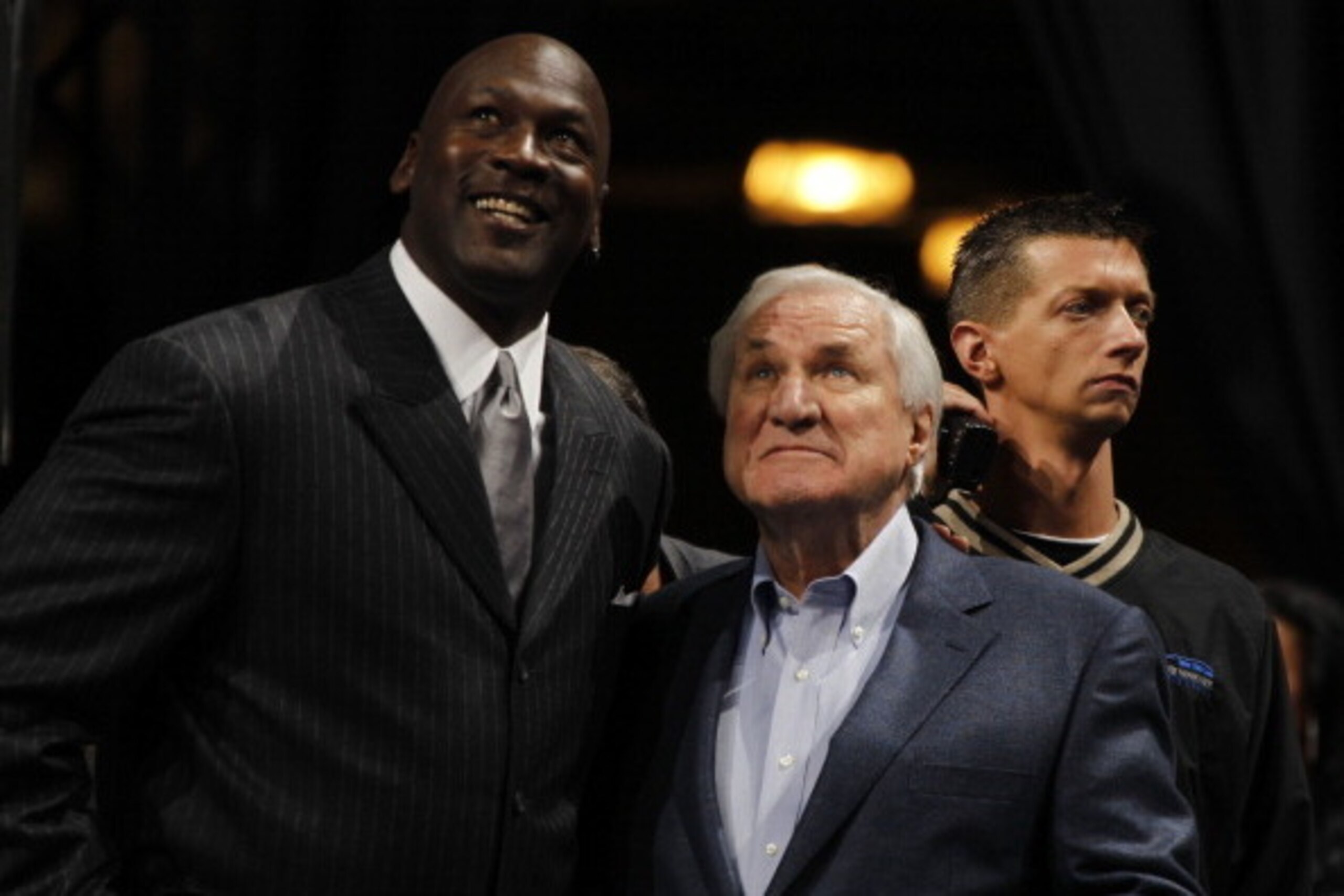 CHARLOTTE, NC - DECEMBER 14:  Michael Jordan, owner of the Charlotte Bobcats, waits with former coach Dean Smith before being inducted into the North Carolina Sports Hall of Fame on December 14, 2010 at Time Warner Cable Arena in Charlotte, North Carolina