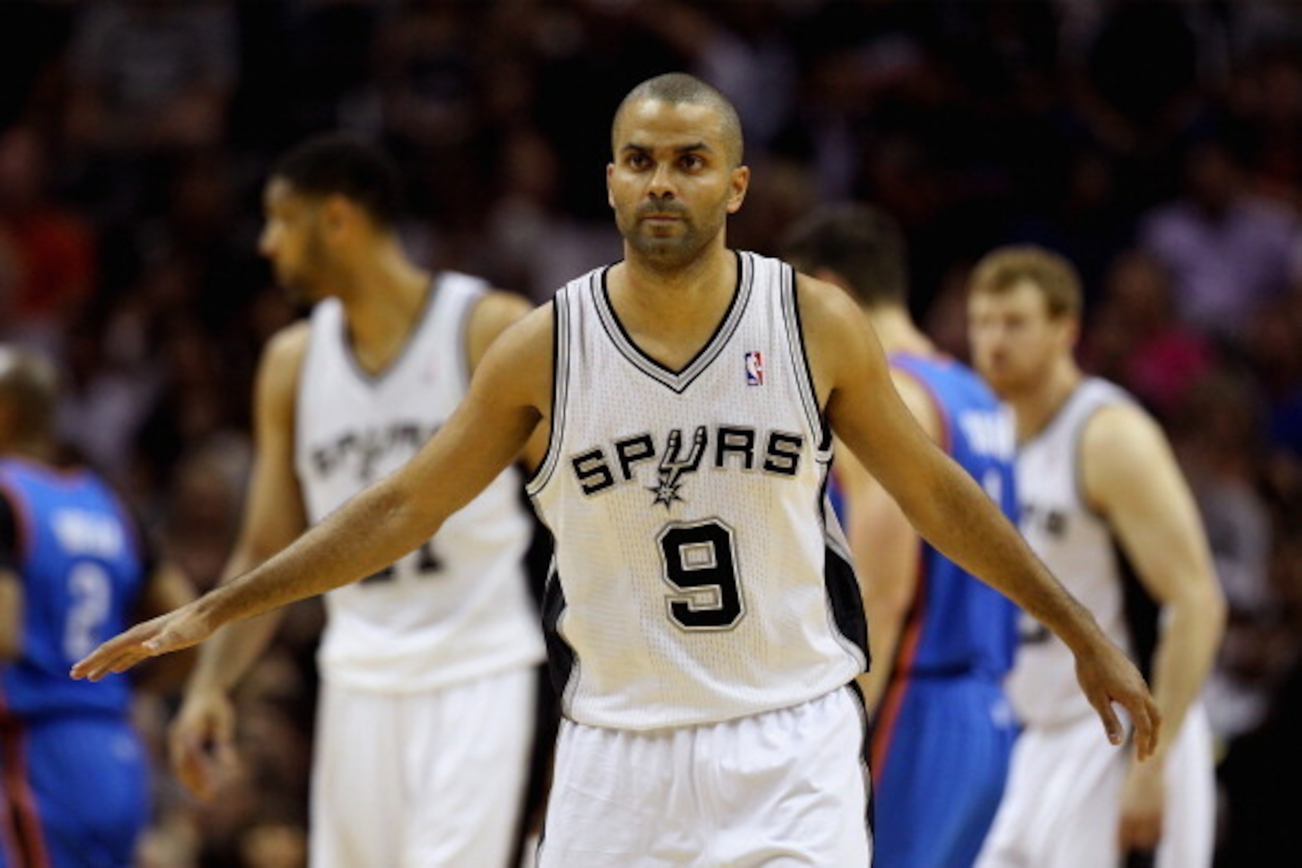 SAN ANTONIO, TX - MAY 29: Tony Parker #9 of the San Antonio Spurs looks on in the first half against the Oklahoma City Thunder during Game Five of the Western Conference Finals of the 2014 NBA Playoffs at AT&T Center on May 29, 2014 in San Antonio, Texas.