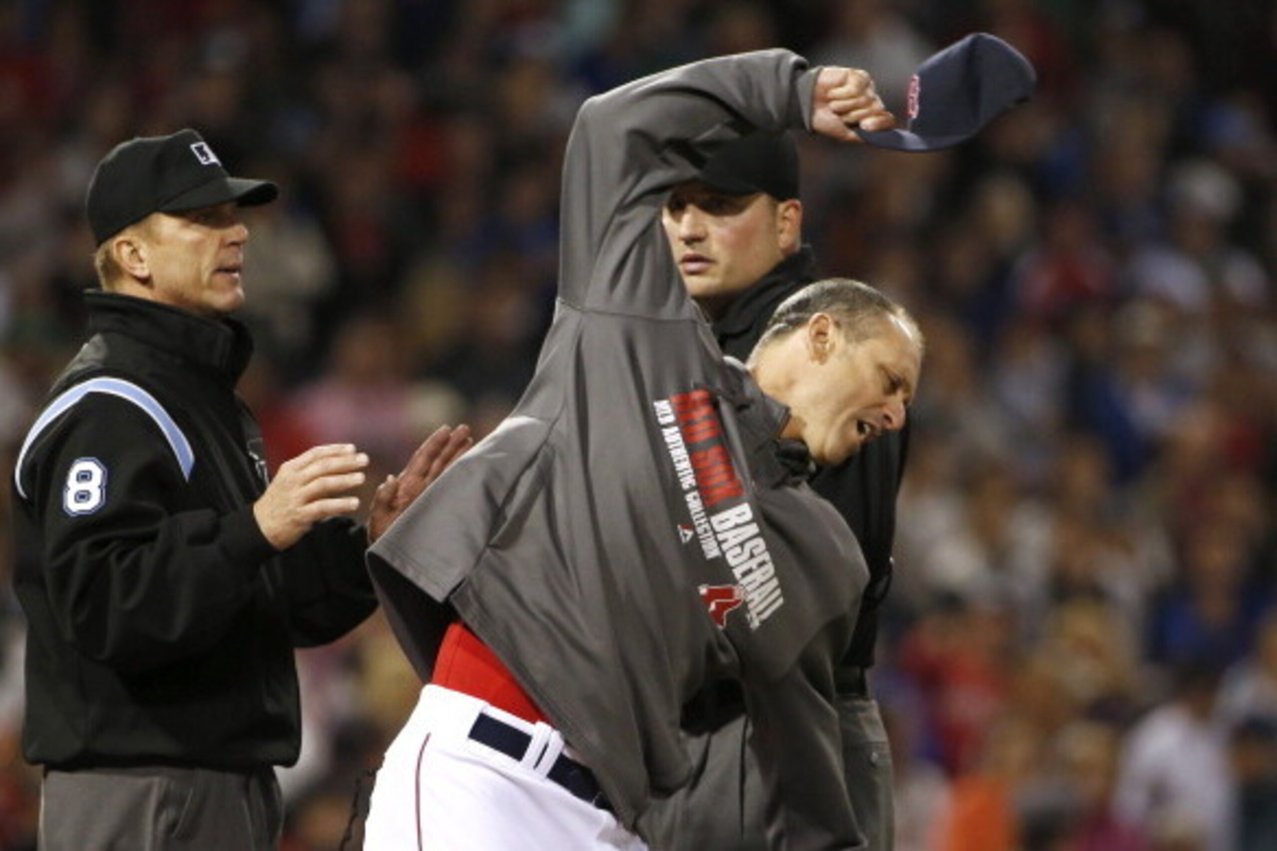 BOSTON, MA - MAY 30: Filling in for ejected manager John Farrell #53 of the Boston Red Sox, bench coach Torey Lovullo #17 of the Boston Red Sox throws his cap while arguing with umpiring crew chief Jeff Kellogg #8 after Mike Carp #37 of the Boston Red So BOSTON, MA - MAY 30: Filling in for ejected manager John Farrell #53 of the Boston Red Sox, bench coach Torey Lovullo #17 of the Boston Red Sox throws his cap while arguing with umpiring crew chief Jeff Kellogg #8 after Mike Carp #37 of the Boston Red So
