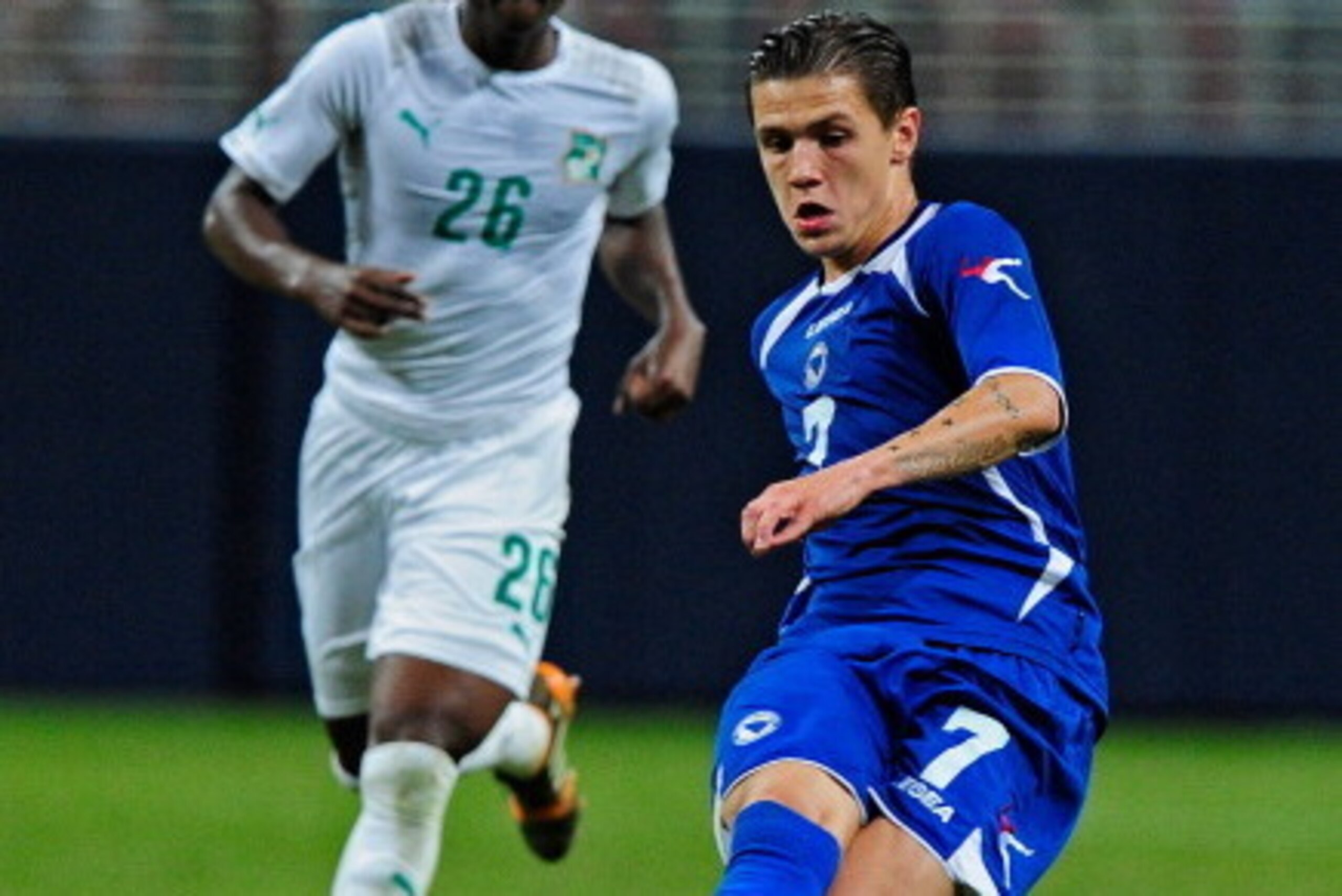 ST. LOUIS, MO - MAY 30: Muhamed Besic #7 of the Bosnia-Herzegovina passes the ball against the Ivory Coast during the second half of a friendly match at Edward Jones Dome on May 30, 2014 in St. Louis, Missouri. Bosnia-Herzegovina defeated Ivory Coast 2-1.