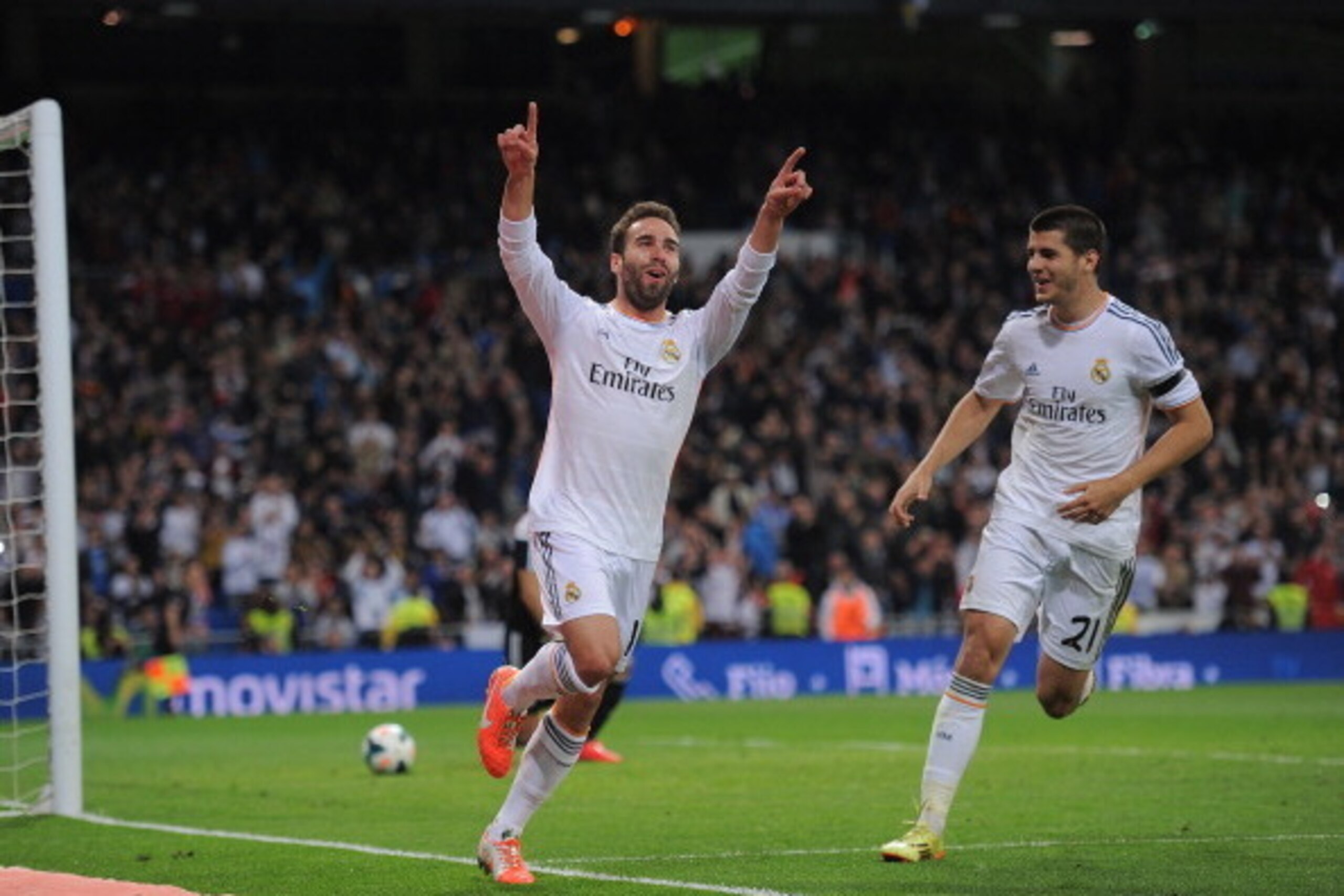 MADRID, SPAIN - APRIL 26:  Daniel Carvajal (L) of Real Madrid CF celebrates with Alvaro Morata after scoring Real's 4th goal from a free kick during the La Liga match between Real Madrid CF and CA Osasuna at the Santiago Bernabeu stadium on April 26, 2014