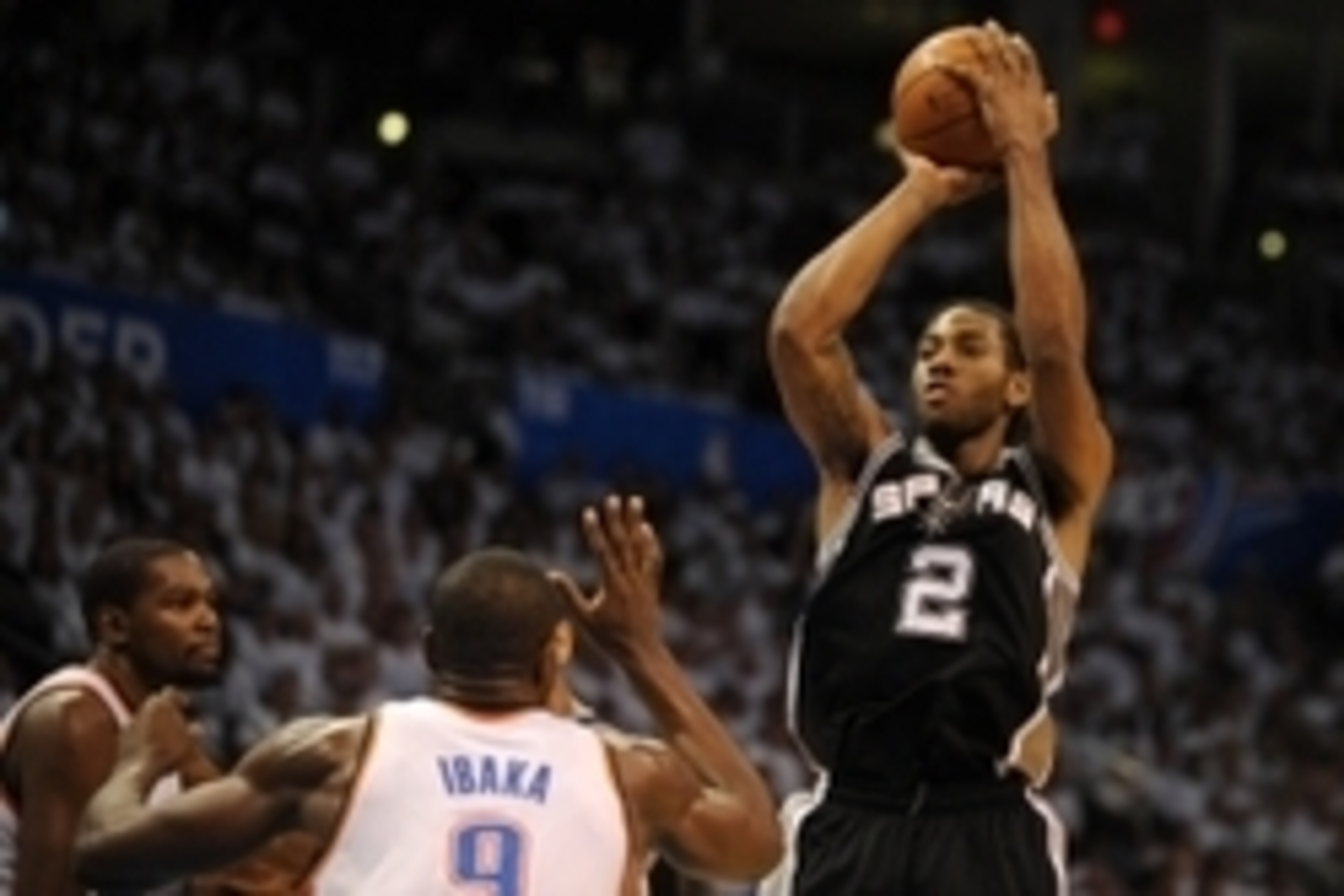 May 31, 2014; Oklahoma City, OK, USA; San Antonio Spurs forward Kawhi Leonard (2) attempts a shot against the Oklahoma City Thunder during the fourth quarter in game six of the Western Conference Finals of the 2014 NBA Playoffs at Chesapeake Energy Arena.