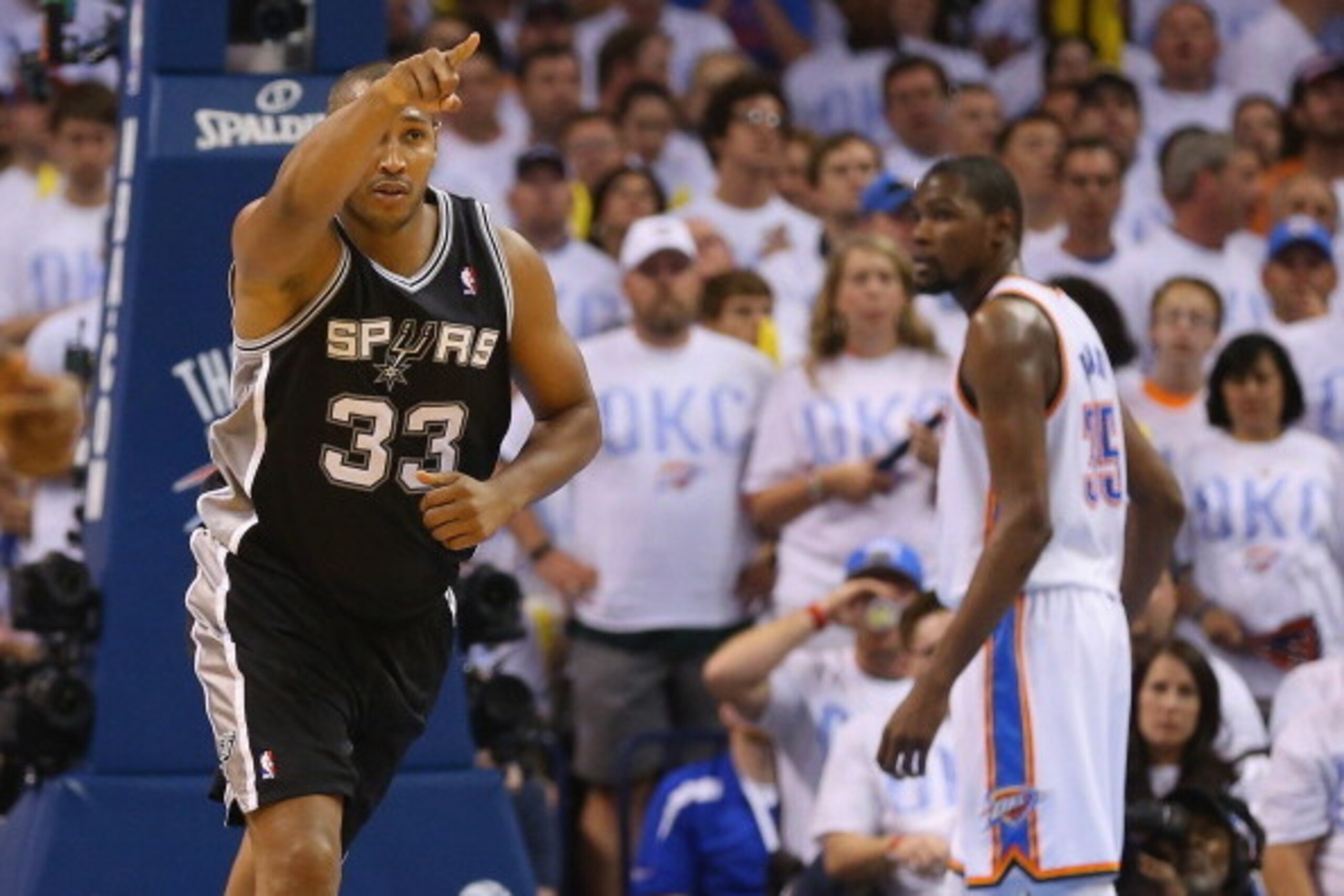 OKLAHOMA CITY, OK - MAY 31:  Boris Diaw #33 of the San Antonio Spurs reacts to a play in the second half as Kevin Durant #35 of the Oklahoma City Thunder looks on during Game Six of the Western Conference Finals of the 2014 NBA Playoffs at Chesapeake Ener