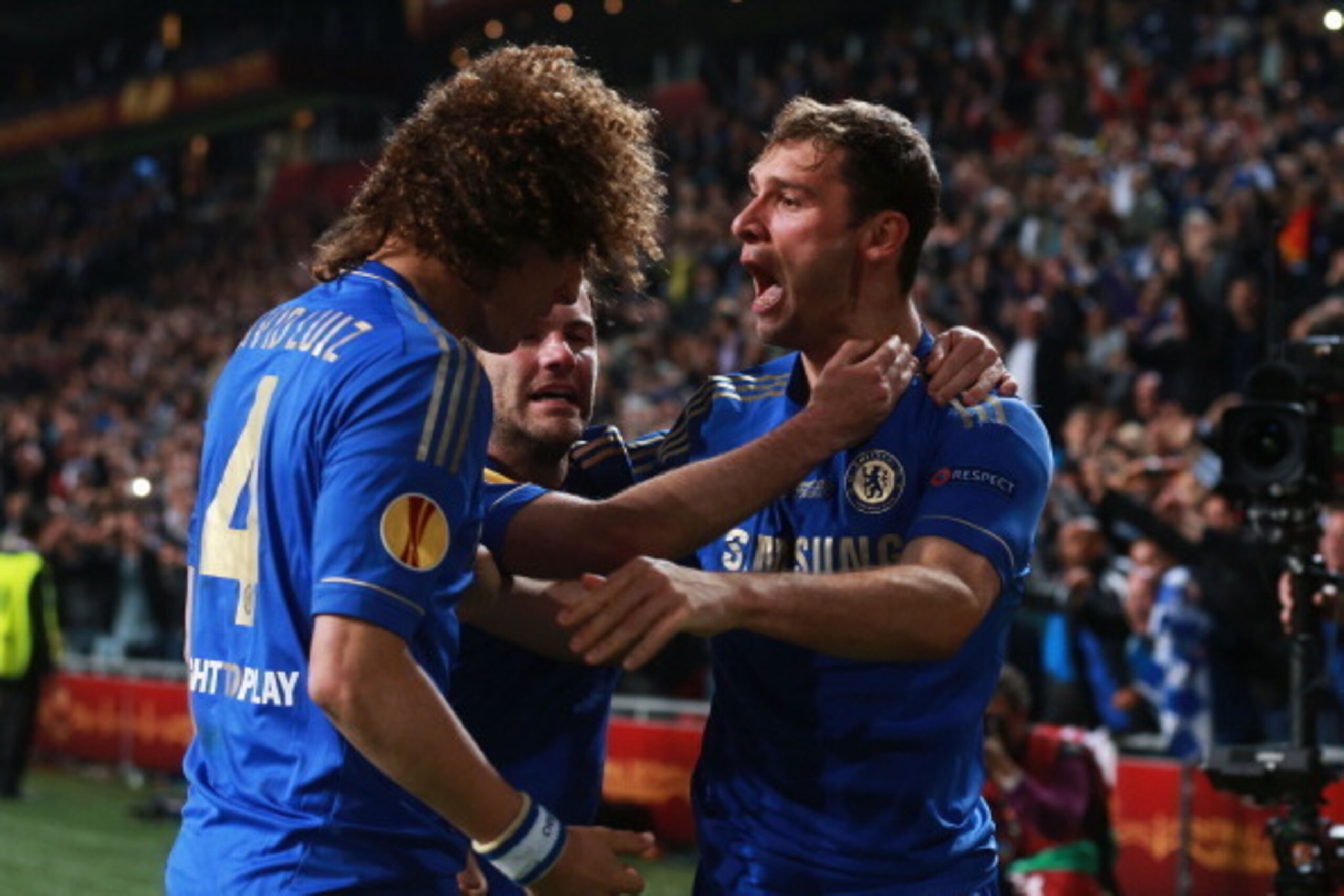 AMSTERDAM, NETHERLANDS - MAY 15:  Branislav Ivanovic of Chelsea celebrates scoring their second and winning goal with David Luiz and Juan Mata during the UEFA Europa League Final between SL Benfica and Chelsea FC at Amsterdam Arena on May 15, 2013 in Amst
