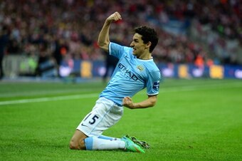 LONDON, ENGLAND - MARCH 02:  Jesus Navas of Manchester City celebrates after scoring his team's third goal during the Capital One Cup Final between Manchester City and Sunderland at Wembley Stadium  on March 2, 2014 in London, England.  (Photo by Jamie Mc