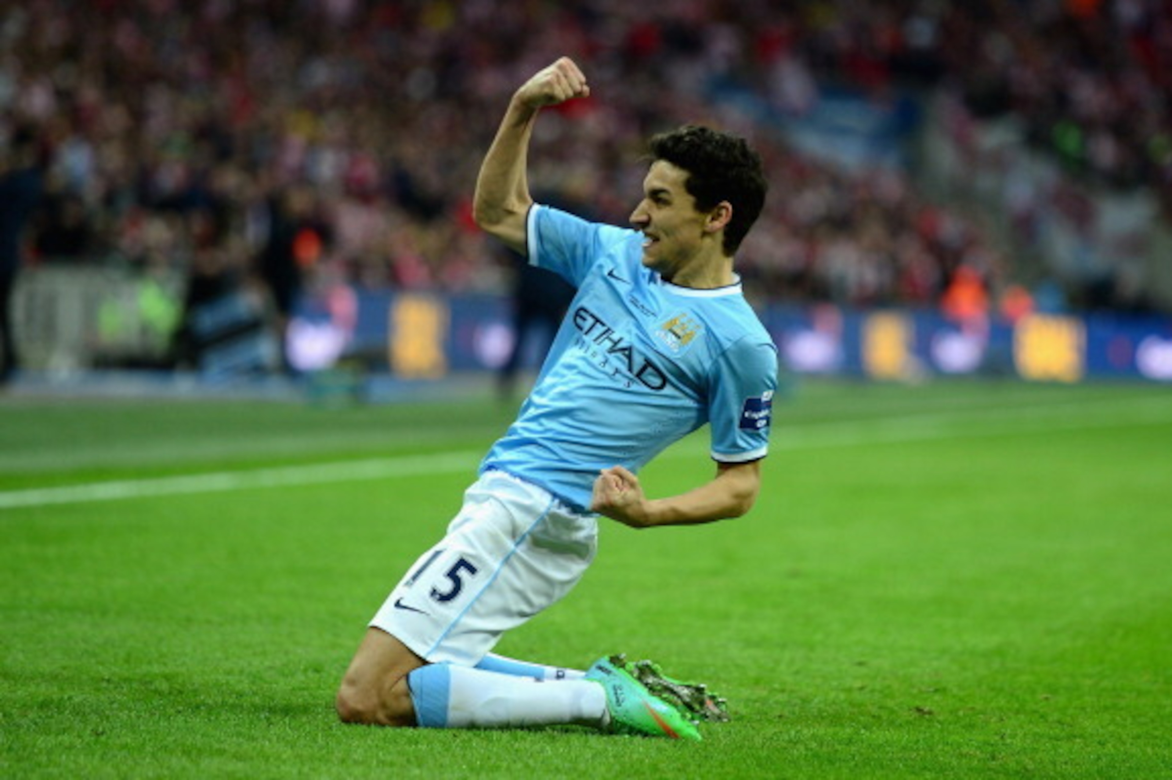 LONDON, ENGLAND - MARCH 02:  Jesus Navas of Manchester City celebrates after scoring his team's third goal during the Capital One Cup Final between Manchester City and Sunderland at Wembley Stadium  on March 2, 2014 in London, England.  (Photo by Jamie Mc