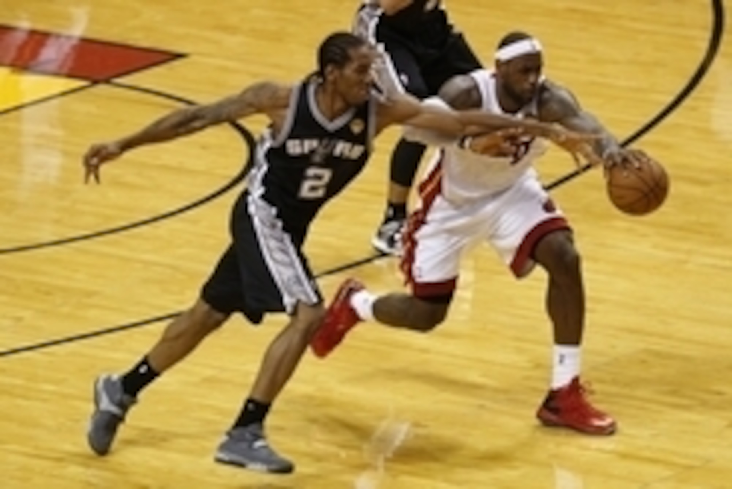 Jun 20, 2013; Miami, FL, USA; Miami Heat small forward LeBron James (6) and San Antonio Spurs small forward Kawhi Leonard (2) battle for a loose ball during the second quarter of game seven in the 2013 NBA Finals at American Airlines Arena. Mandatory Cred