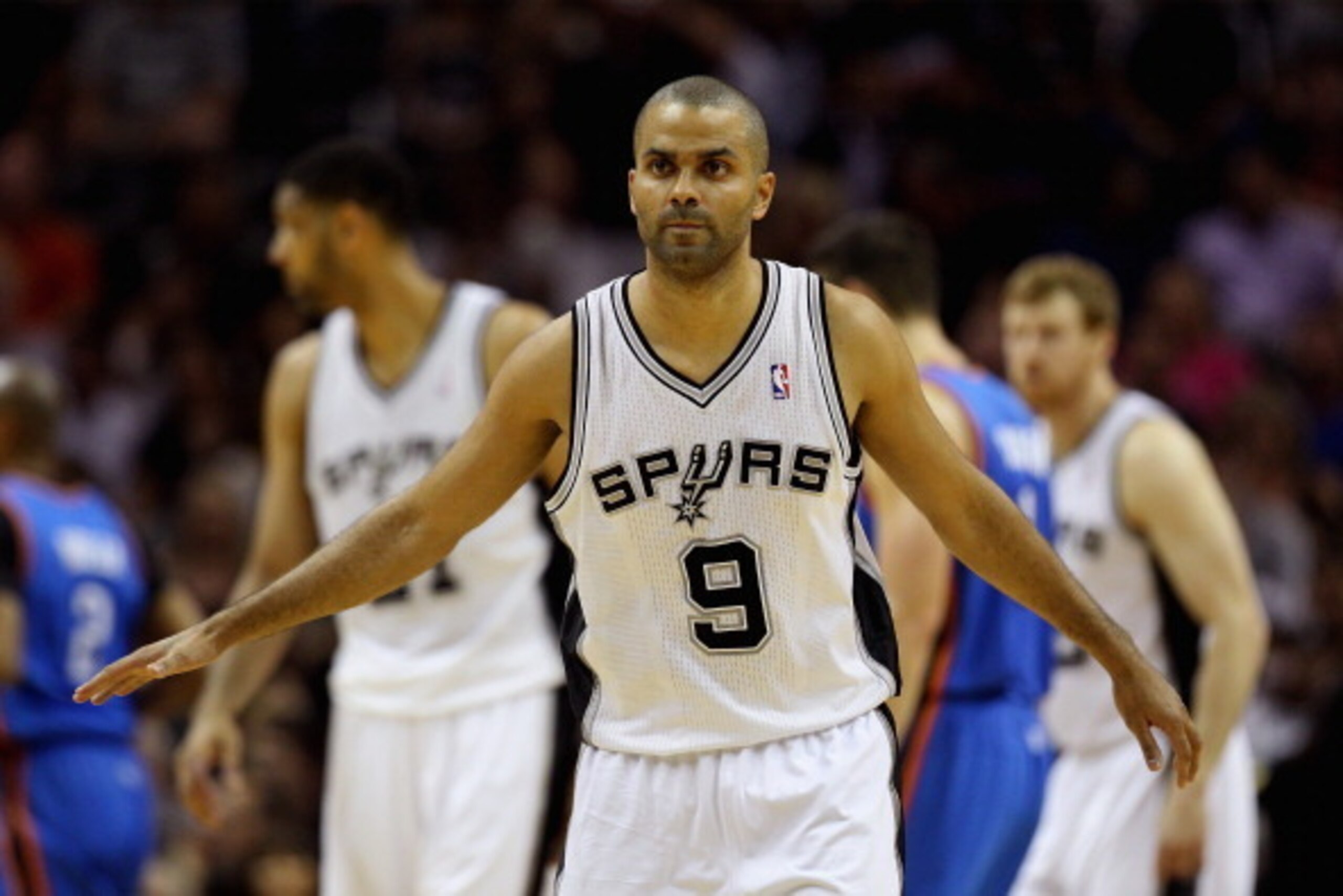 SAN ANTONIO, TX - MAY 29: Tony Parker #9 of the San Antonio Spurs looks on in the first half against the Oklahoma City Thunder during Game Five of the Western Conference Finals of the 2014 NBA Playoffs at AT&T Center on May 29, 2014 in San Antonio, Texas.