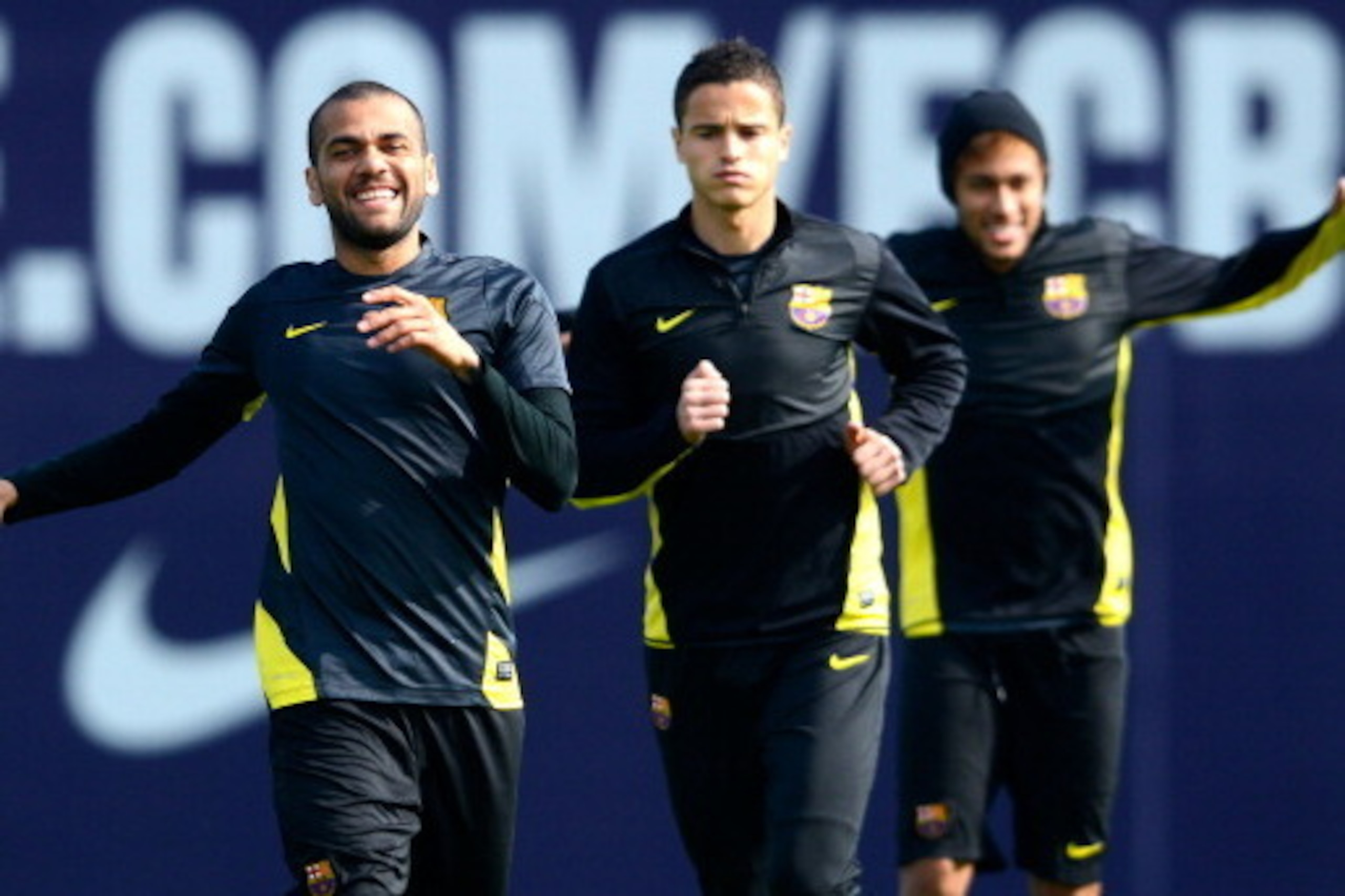 BARCELONA, SPAIN - MARCH 11: (L-R) Dani Alves, Ibrahim Afellay and Neymar of FC Barcelona warm up during a training session ahead the UEFA Champions League Round of 16 second Leg match against Manchester City at the Sant Joan Despi Sport Complex on March 
