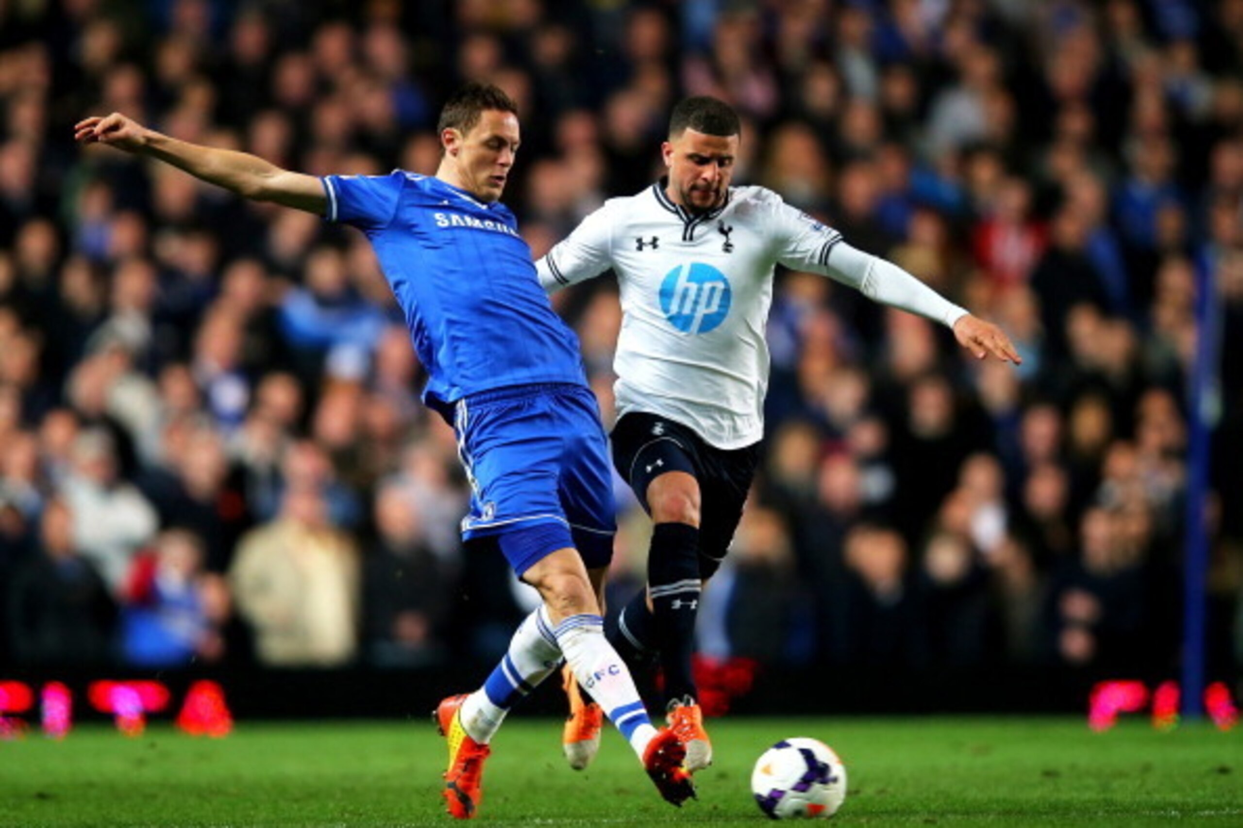 LONDON, ENGLAND - MARCH 08:  Nemanja Matic of Chelsea and Kyle Walker of Spurs compete for the ball during the Barclays Premier League match between Chelsea and Tottenham Hotspur at Stamford Bridge on March 8, 2014 in London, England.  (Photo by Clive Ros