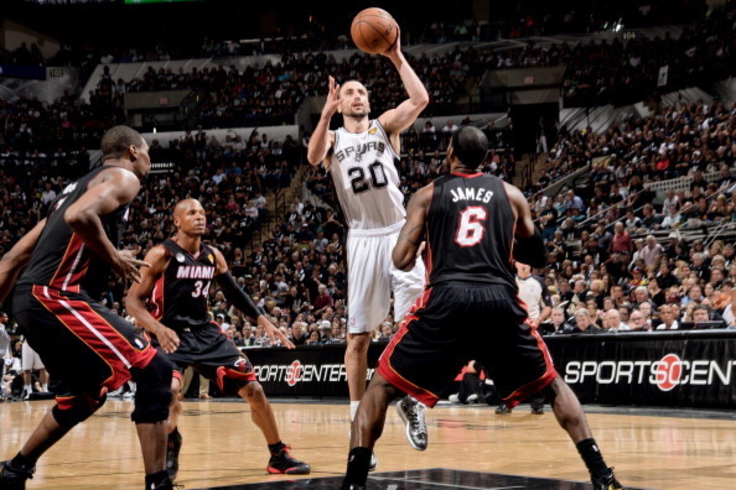 SAN ANTONIO, TX - JUNE 16: Manu Ginobili #20 of the San Antonio Spurs shoots in the lane against LeBron James #6 of the Miami Heat during Game Five of the 2013 NBA Finals on June 16, 2013 at AT&T Center in San Antonio, Texas. NOTE TO USER: User expressly 