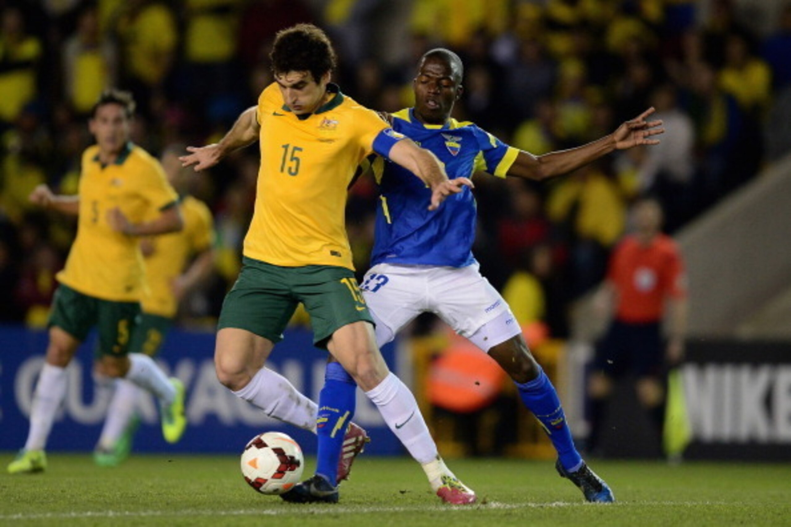 LONDON, ENGLAND - MARCH 05:  Mile Jedinak of Australia battles with Enner Valencia of Ecuador during the International Friendly match between Australia and Ecuador at The Den on March 5, 2014 in London, England.  (Photo by Jamie McDonald/Getty Images)