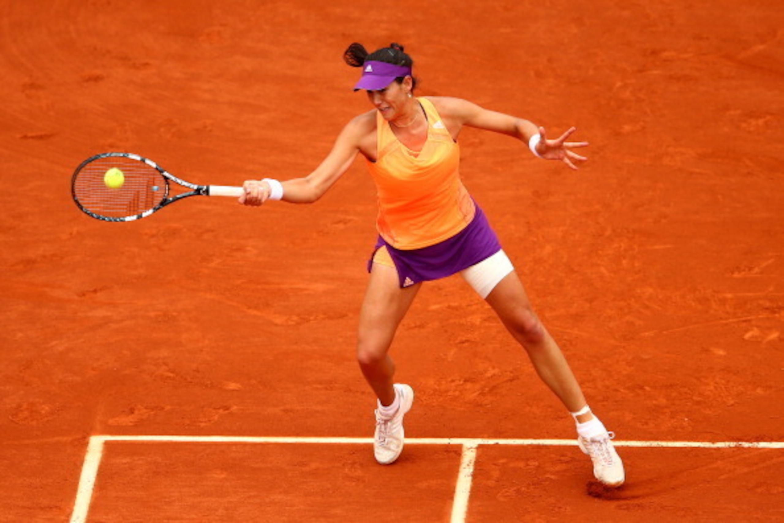 PARIS, FRANCE - JUNE 03: Garbine Muguruza of Spain returns a shot during her women's singles quarter-final match against Maria Sharapova of Russia on day ten of the French Open at Roland Garros on June 3, 2014 in Paris, France. (Photo by Clive Brunskill PARIS, FRANCE - JUNE 03: Garbine Muguruza of Spain returns a shot during her women's singles quarter-final match against Maria Sharapova of Russia on day ten of the French Open at Roland Garros on June 3, 2014 in Paris, France. (Photo by Clive Brunskill