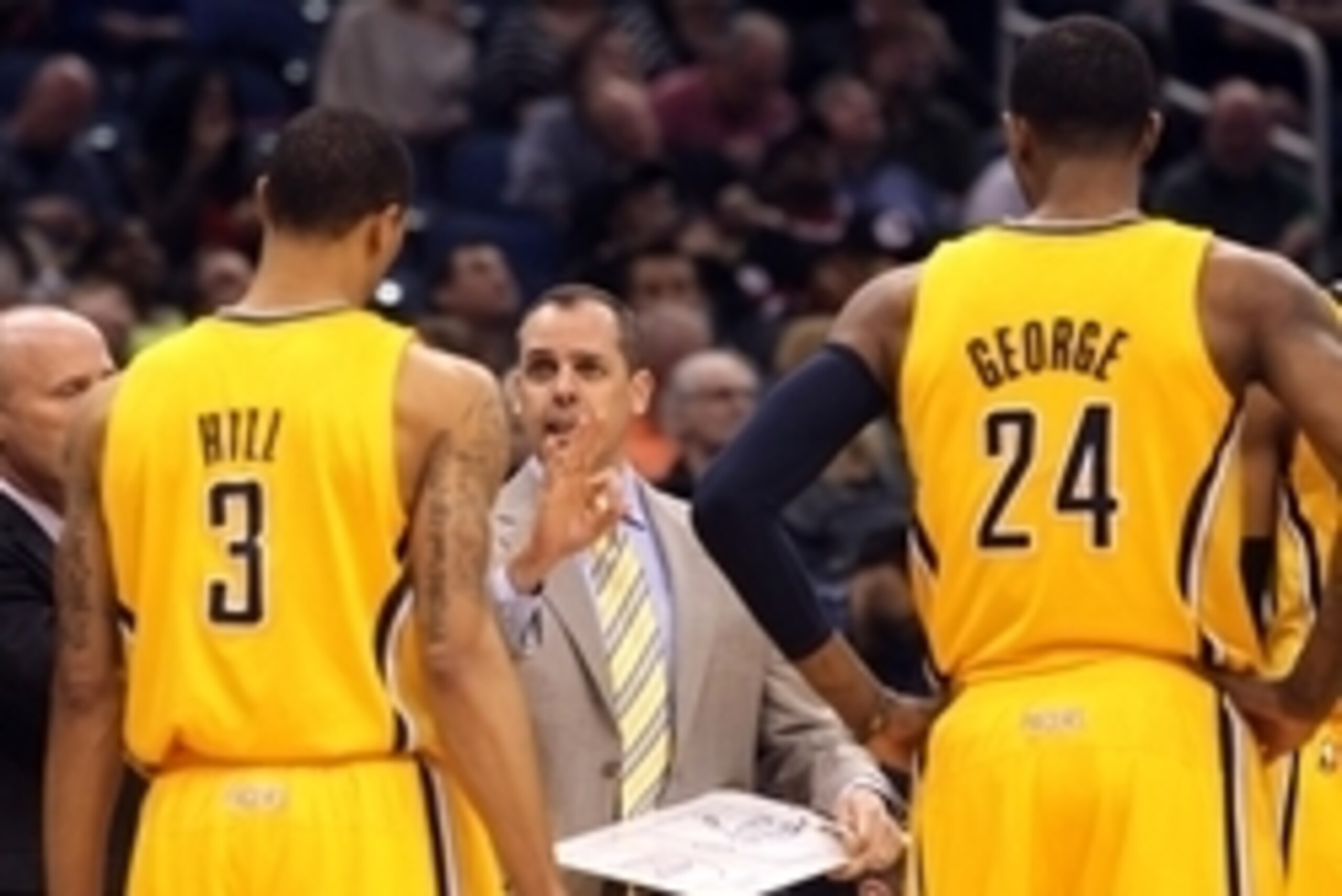 March 8, 2013; Orlando FL, USA; Indiana Pacers head coach Frank Vogel talks with point guard George Hill (3) and small forward Paul George (24) against the Orlando Magic during the first quarter at Amway Center. Mandatory Credit: Kim Klement-USA TODAY Spo