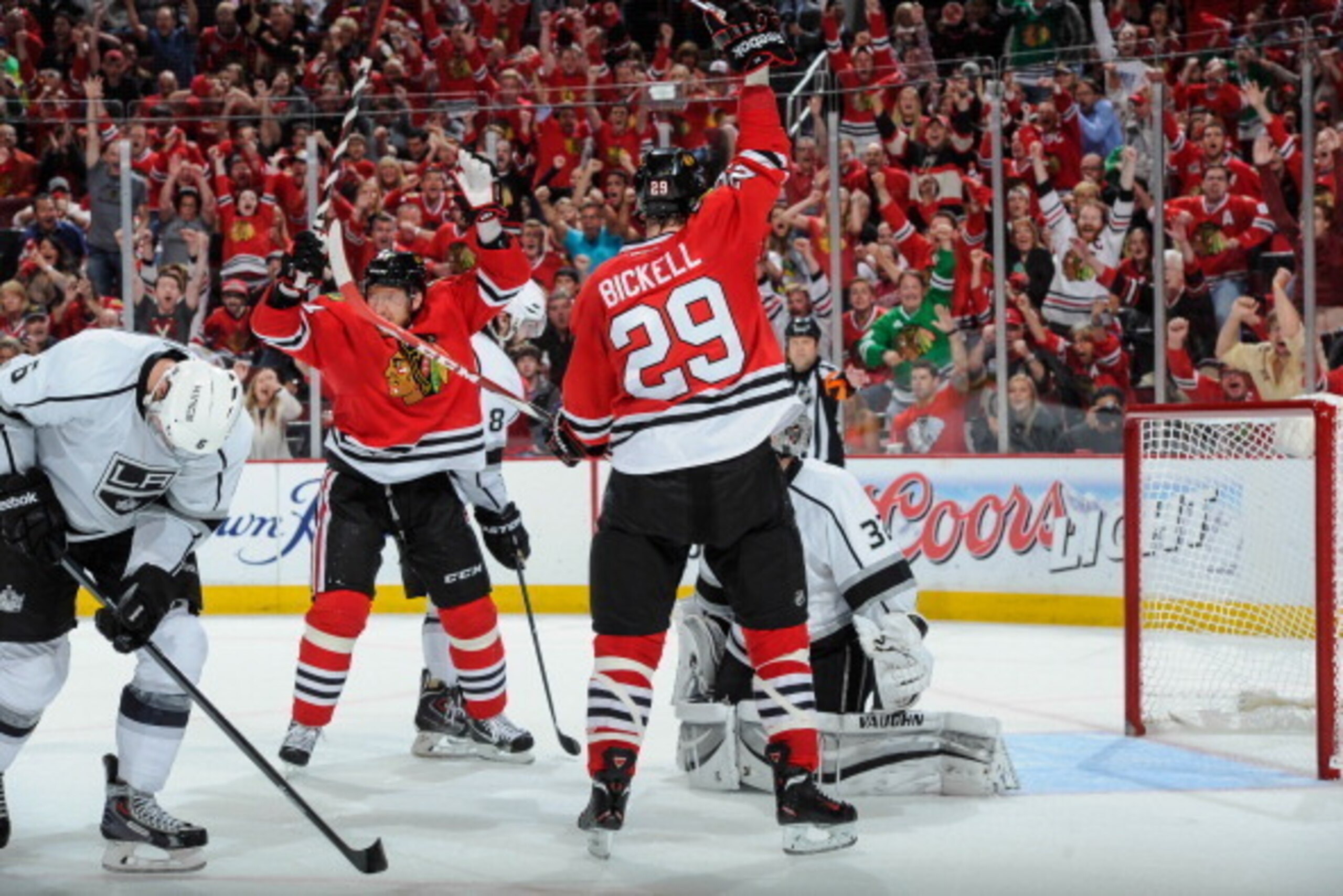 CHICAGO, IL - JUNE 1: Bryan Bickell #29 and Marian Hossa #81 of the Chicago Blackhawks react after teammate Patrick Sharp #10 (not pictured) scored against the Los Angeles Kings late in the second period in Game Seven of the Western Conference Final durin