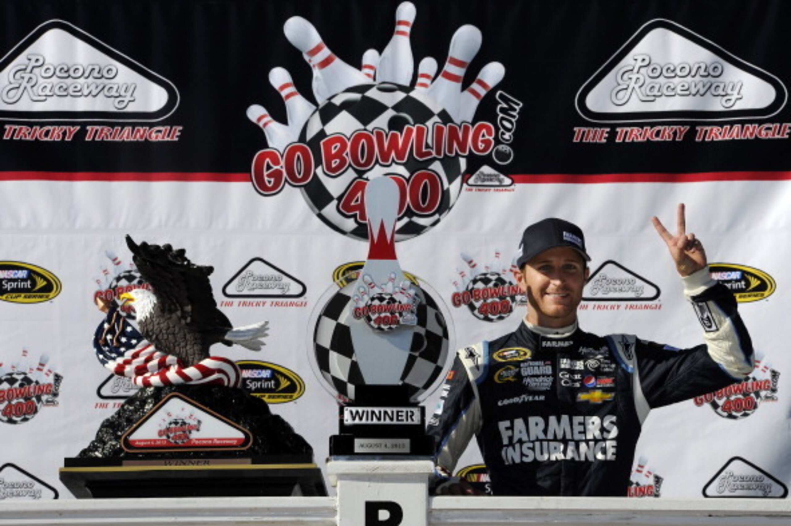 LONG POND, PA - AUGUST 04:  Kasey Kahne, driver of the #5 Farmers Insurance Chevrolet, celebrates in victory lane after winning the NASCAR Sprint Cup Series GoBowling.com 400 at Pocono Raceway on August 4, 2013 in Long Pond, Pennsylvania.  (Photo by John 