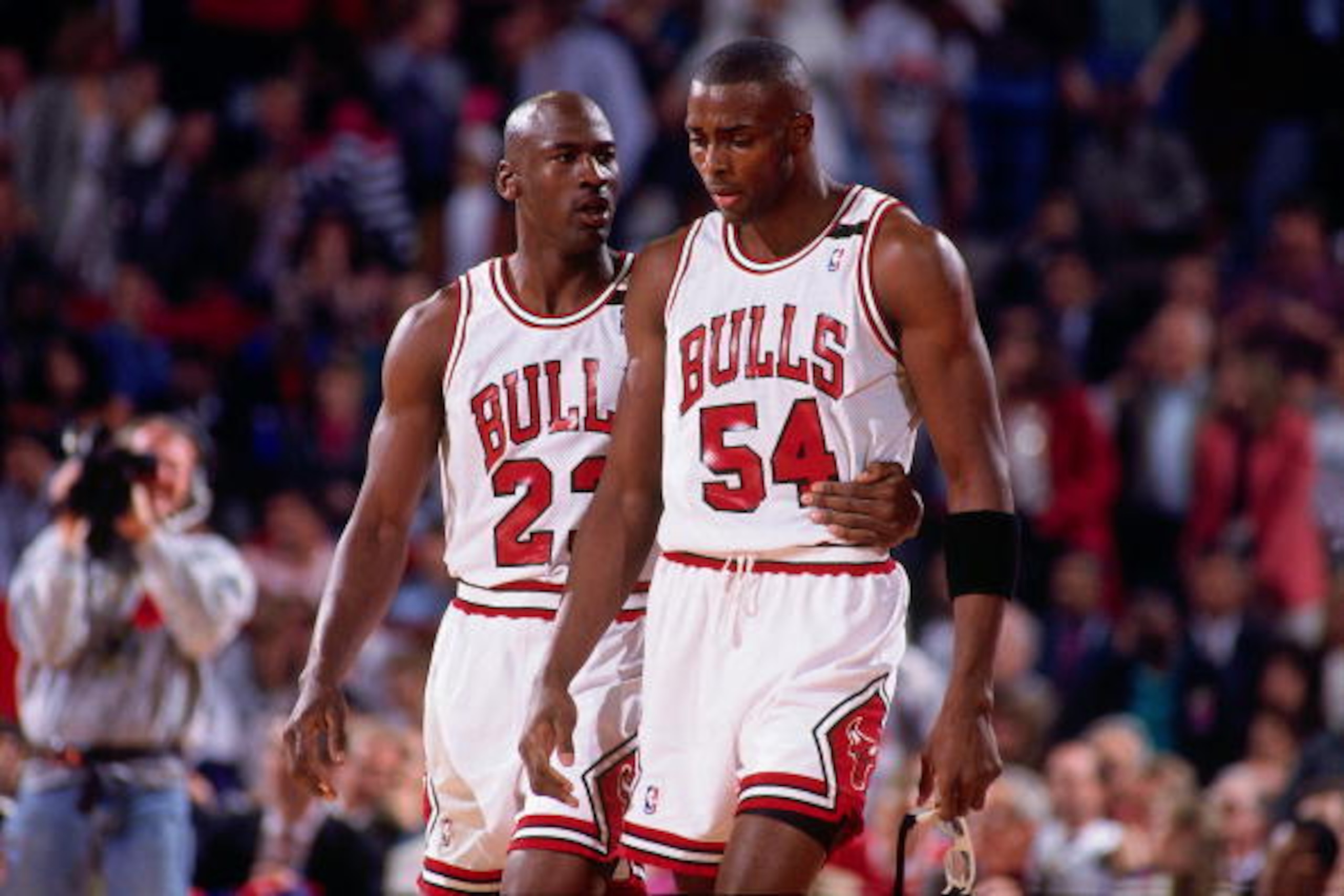 CHICAGO - MAY 19:  Michael Jordan #23 comforts teammate Horace Grant #54 of the Chicago Bulls during Game One of the Eastern Conference Finals against the Cleveland Cavaliers played on May 19, 1992 at Chicago Stadium in Chicago, Illinois.  NOTE TO USER: U