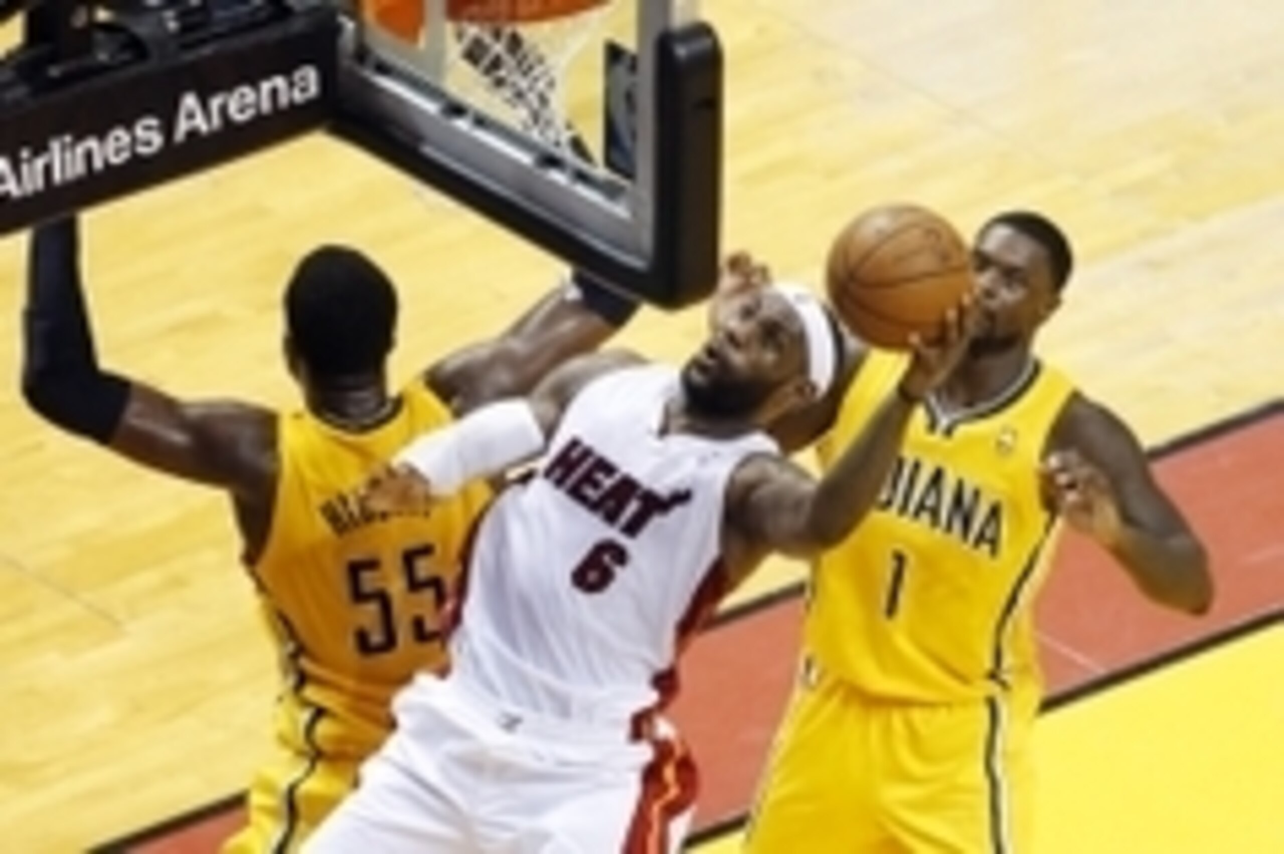 May 30, 2014; Miami, FL, USA; Miami Heat forward LeBron James (6) shoots between Indiana Pacers center Roy Hibbert (55) and guard Lance Stephenson (1) during the first half in game six of the Eastern Conference Finals of the 2014 NBA Playoffs at American 