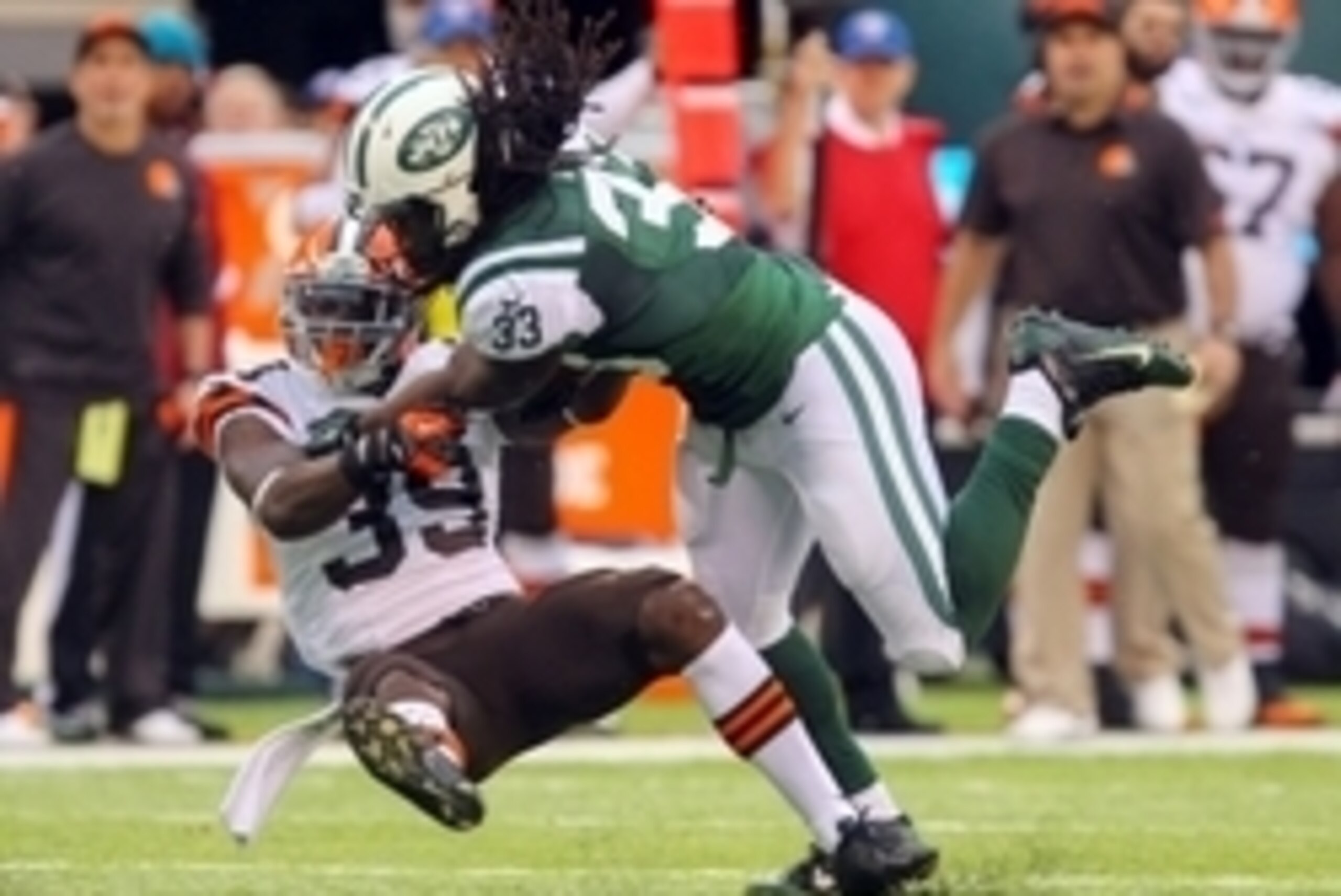 Dec 22, 2013; East Rutherford, NJ, USA; Cleveland Browns free safety Tashaun Gipson (39) tackles New York Jets running back Chris Ivory (33) during the first half at MetLife Stadium. Mandatory Credit: Ed Mulholland-USA TODAY Sports