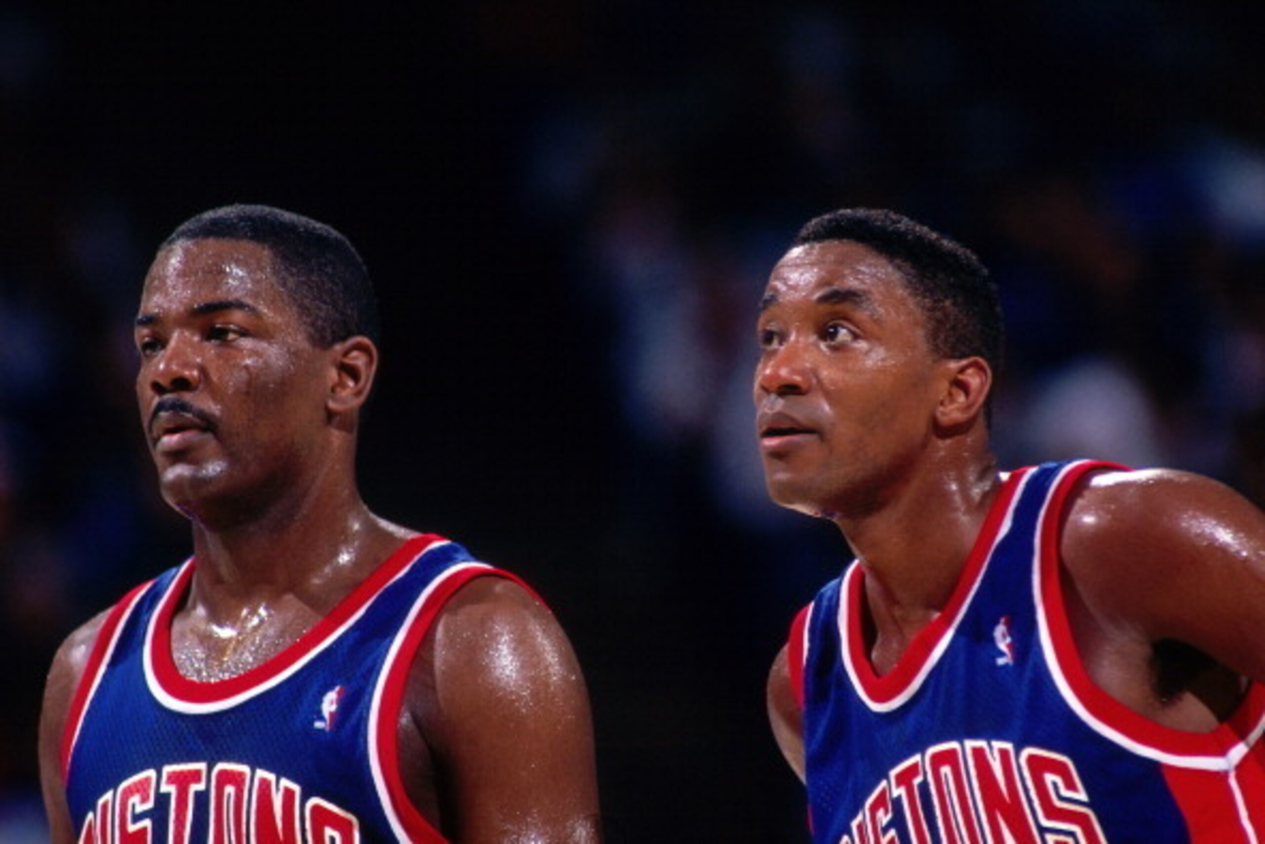 SACRAMENTO, CA - 1993: Joe Dumars #4 and Isiah Thomas #11 of the Detroit Pistons look on against the Sacramento Kings during a game played on March 16, 1993 at Arco Arena in Sacramento, California. NOTE TO USER: User expressly acknowledges and agrees that