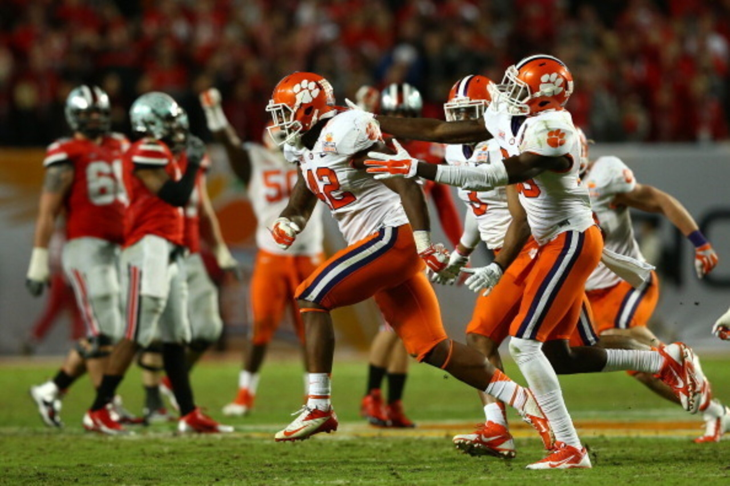 MIAMI GARDENS, FL - JANUARY 03: Stephone Anthony #42 of the Clemson Tigers celebrates with teammates after an interception late in the game against the Ohio State Buckeyes during the Discover Orange Bowl at Sun Life Stadium on January 3, 2014 in Miami Gar