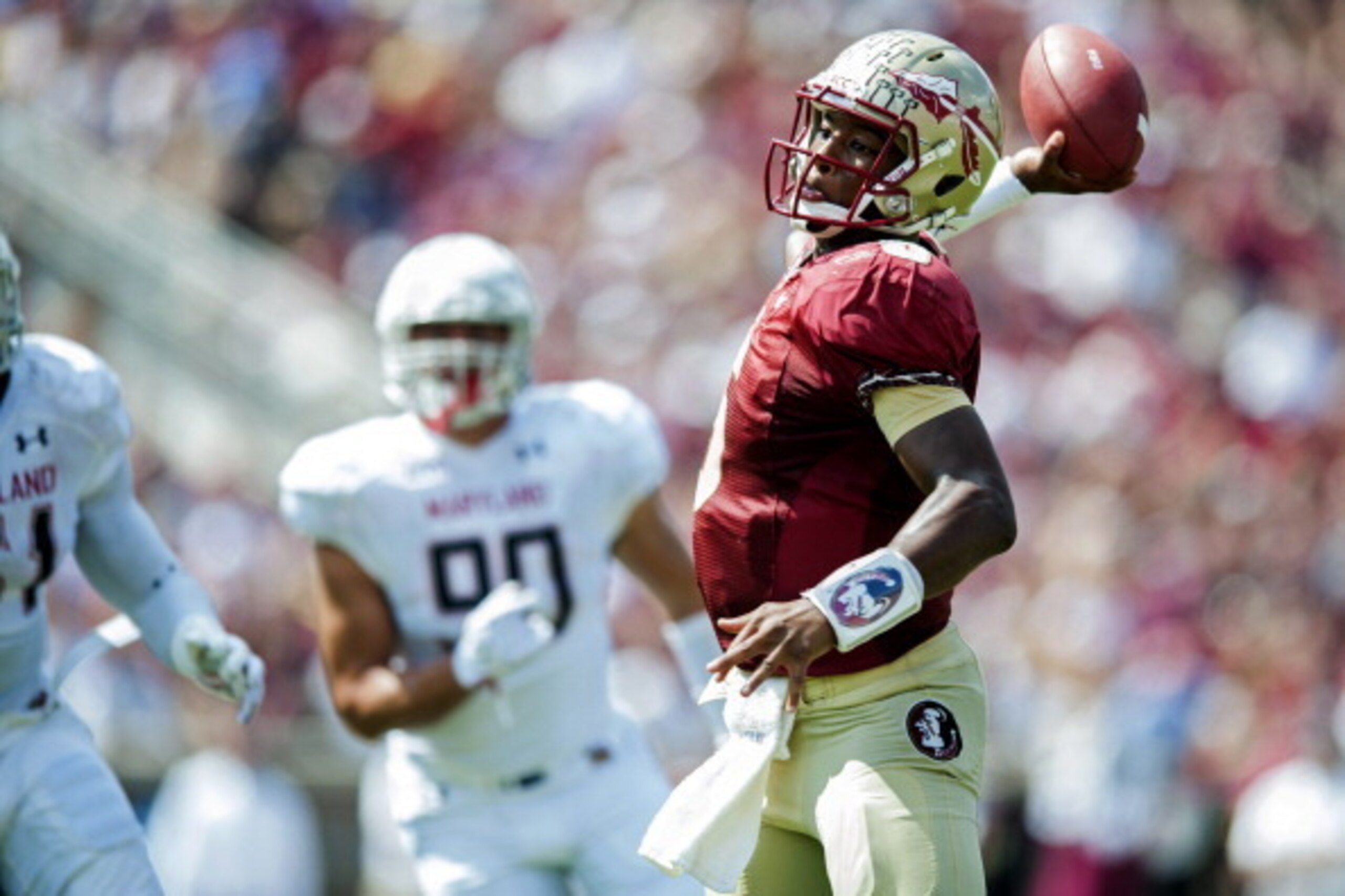 TALLAHASSEE, FL - OCTOBER 5: Jameis Winston #5 of the Florida State Seminoles looks to make a pass against the Maryland Terrapins during the second half on October 5, 2013 at Doak Campbell Stadium in Tallahassee, Florida. The Seminoles went to beat the Te