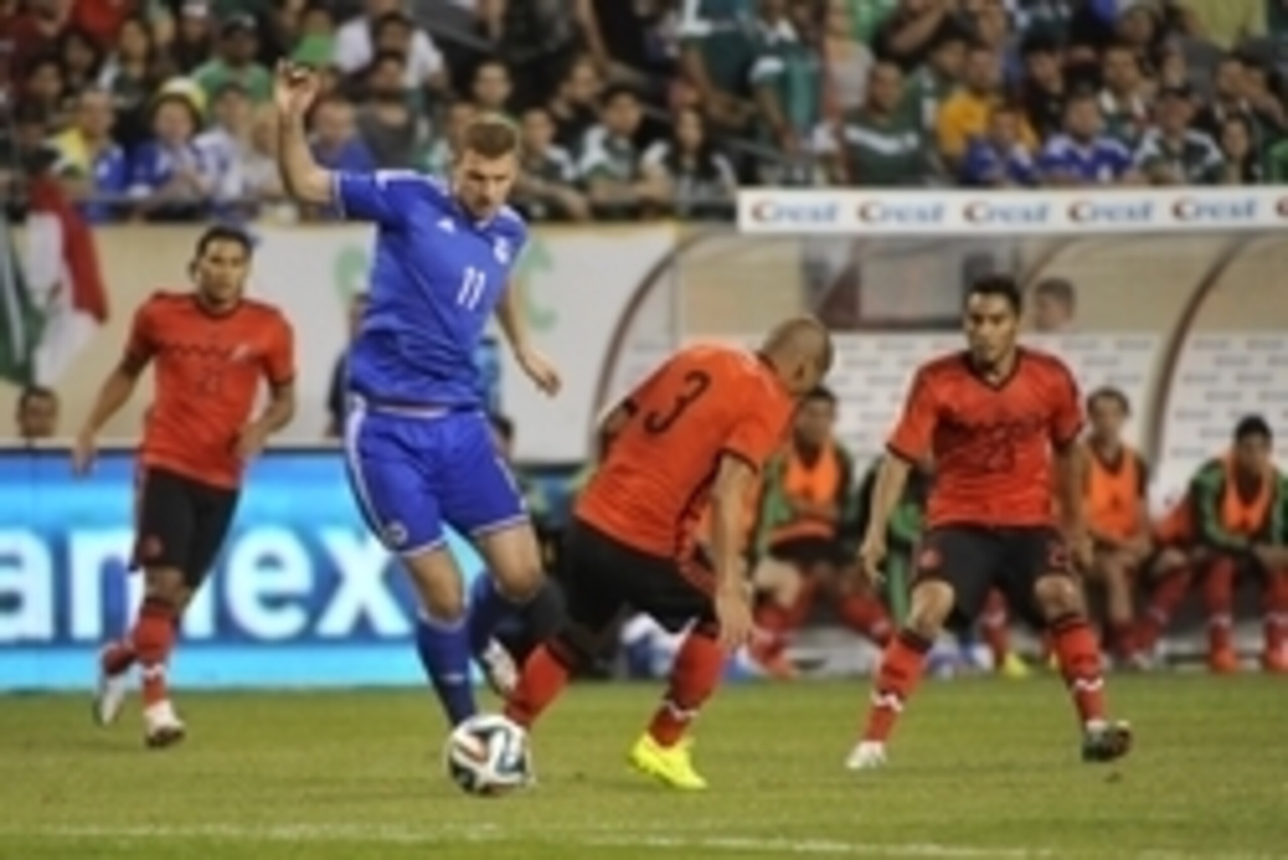 Jun 3, 2014; Chicago, IL, USA; Bosnia and Herzegovina forward Edin Dzeko (11) tries to go around Mexico defender Carlos Salcido (3) during the first half at Soldier Field. Mandatory Credit: David Banks-USA TODAY Sports