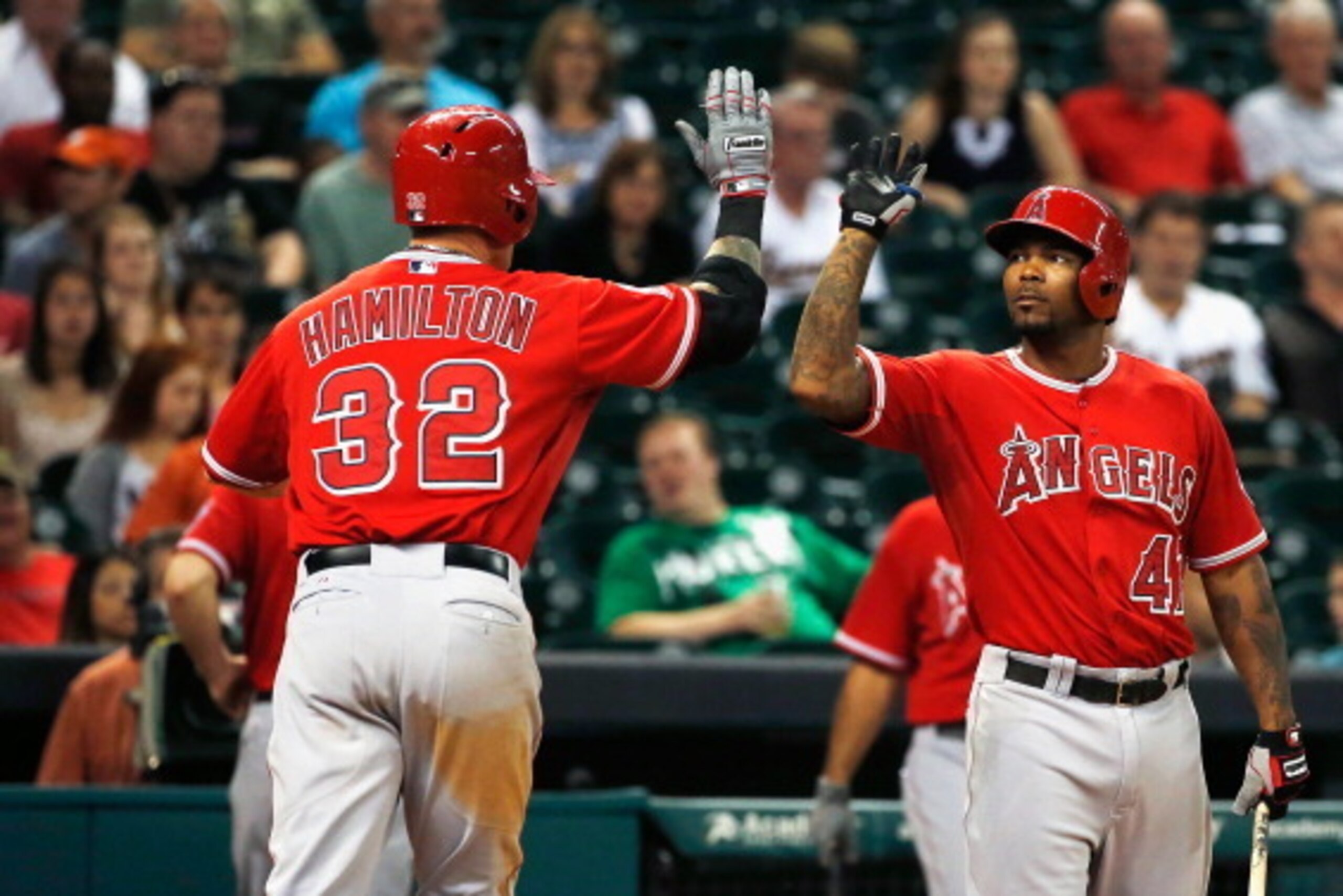 HOUSTON, TX - JUNE 03:  Josh Hamilton #32 of the  Los Angeles Angels of Anaheim is greeted at the plate by teammate Howie Kendrick #47 after Hamilton hit a solo home run in the eighth inning off Tony Sipp #29 of the Houston Astros at Minute Maid Park on J