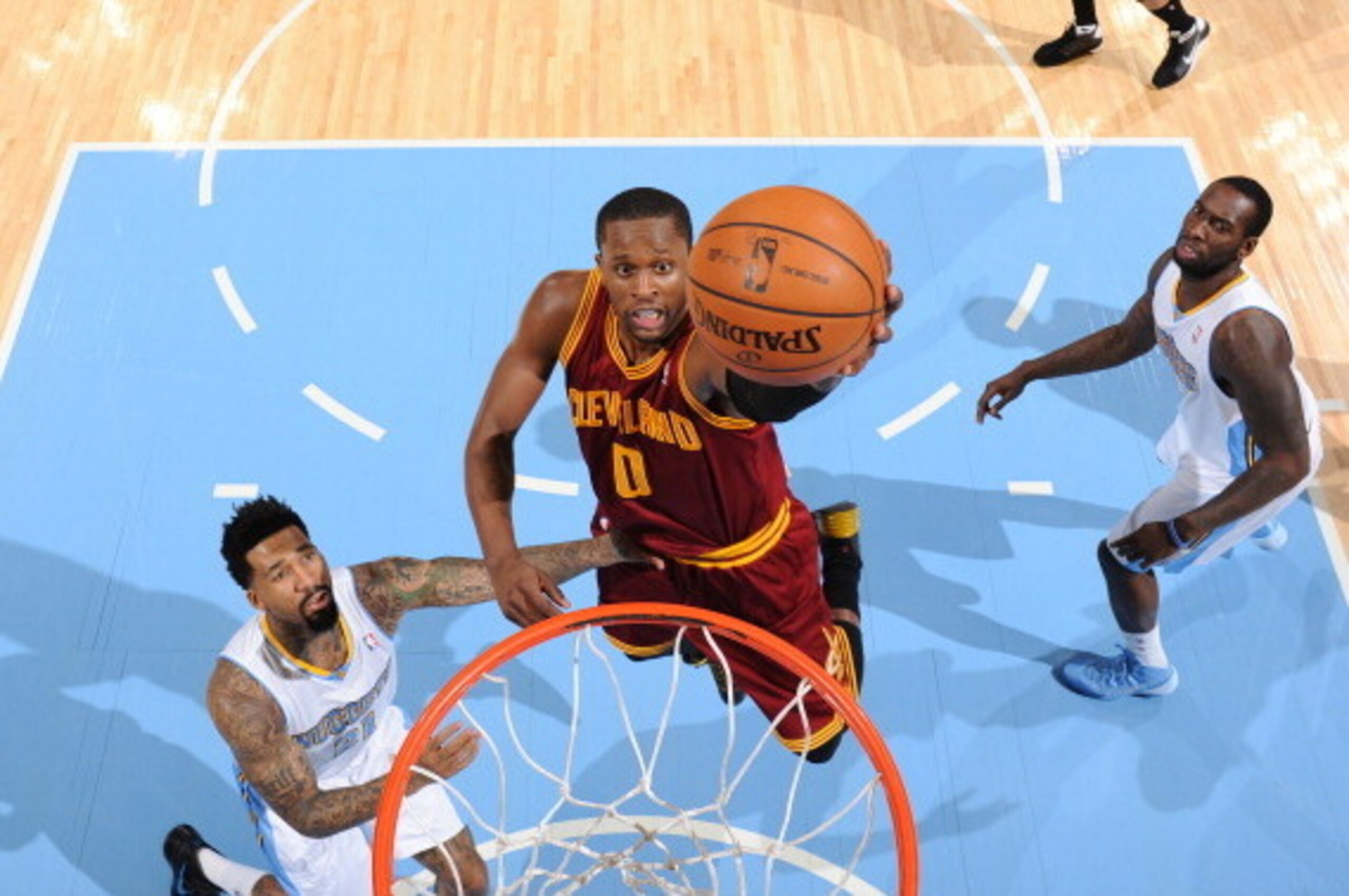 DENVER, CO - January 17: C.J. Miles #0 of the Cleveland Cavaliers making a layup during a game against the Denver Nuggets on January 17, 2014 at the Pepsi Center in Denver, Colorado. NOTE TO USER: User expressly acknowledges and agrees that, by downloadin