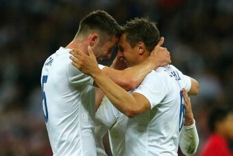 LONDON, ENGLAND - MAY 30:  Gary Cahill of England congratulates Phil Jagielka of England on scoring their third goal during the international friendly match between England and Peru at Wembley Stadium on May 30, 2014 in London, England.  (Photo by Warren 