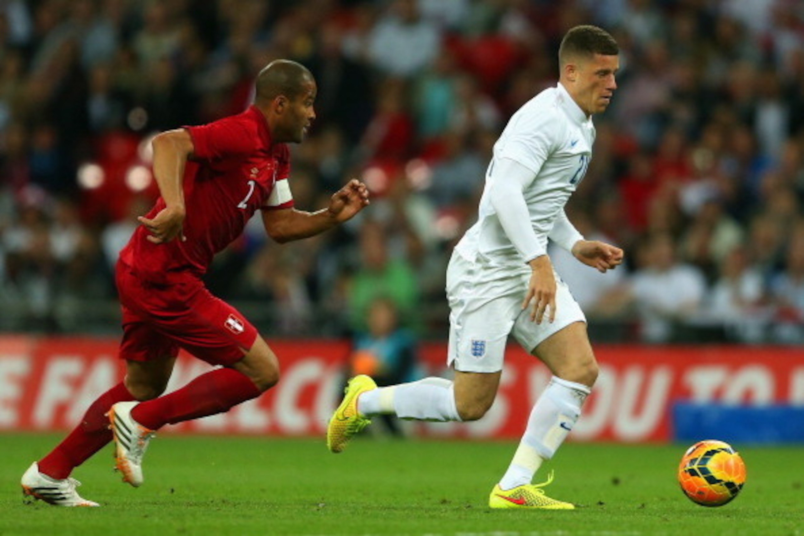 LONDON, ENGLAND - MAY 30:  Alberto Rodriguez of Peru closes down Ross Barkley of England during the international friendly match between England and Peru at Wembley Stadium on May 30, 2014 in London, England.  (Photo by Warren Little/Getty Images)