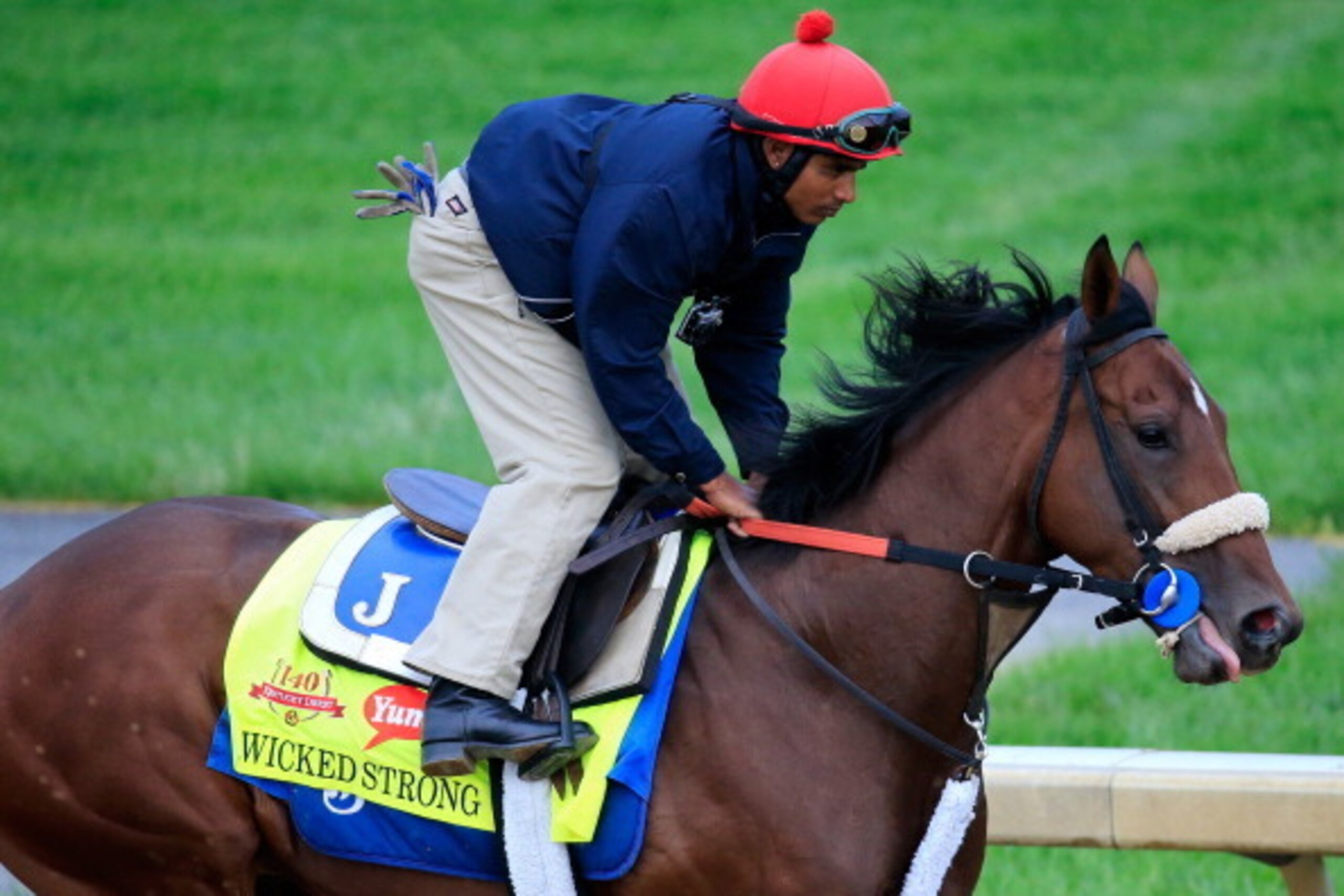 LOUISVILLE, KY - APRIL 30: Wicked Strong ridden by  Kelvin Pahal during the morning exercise session in preparation for the140th Kentucky Derby at Churchill Downs on April 30, 2014 in Louisville, Kentucky.  (Photo by Rob Carr/Getty Images)