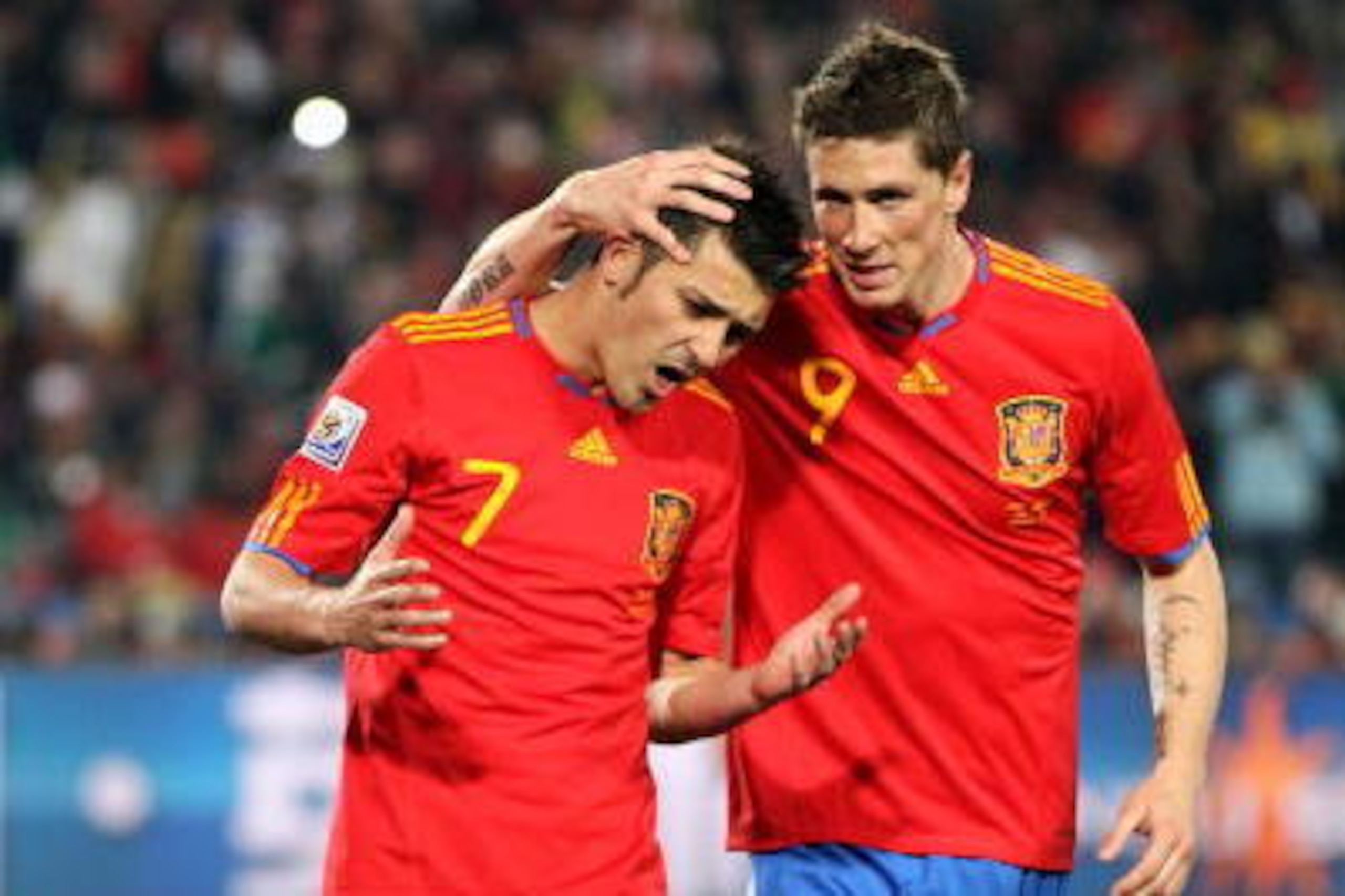 JOHANNESBURG, SOUTH AFRICA - JUNE 21: Fernando Torres consoles David Villa of Spain after he missed a penalty during the 2010 FIFA World Cup South Africa Group H match between Spain and Honduras at Ellis Park Stadium on June 21, 2010 in Johannesburg, Sout