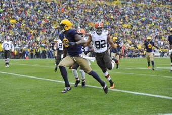 GREEN BAY, WI - OCTOBER 20:  Tight end Jermichael Finley #88 of the Green Bay Packers runs after a catch for a 10-yard touchdown reception during the first quarter against the Cleveland Browns at Lambeau Field on October 20, 2013 in Green Bay, Wisconsin. 