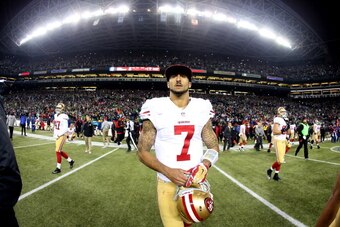 SEATTLE, WA - JANUARY 19:  Quarterback Colin Kaepernick #7 of the San Francisco 49ers walks off the field after losing to the Seattle Seahawks 23-17 during the 2014 NFC Championship at CenturyLink Field on January 19, 2014 in Seattle, Washington.  (Photo 