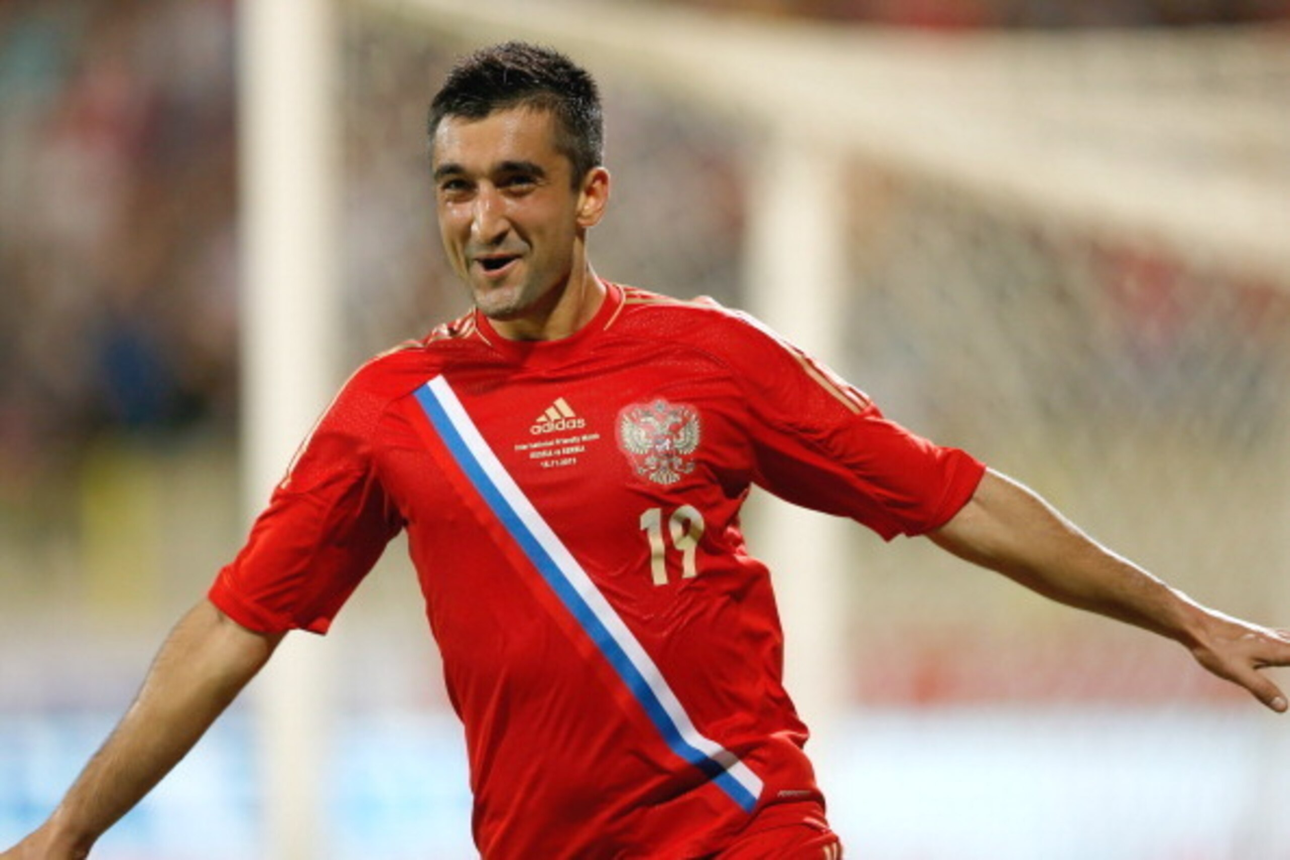 DUBAI, UNITED ARAB EMIRATES - NOVEMBER 15:  Alexander Samedov of Russia celebrate after scoring a goal during the International Football match between Serbia and Russia at the Zabeel Stauduim on November 15, 2013 in Dubai, United Arab Emirates.  (Photo by