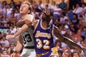 BOSTON - 1987: Larry Bird #33 of the Boston Celtics battles for position against Magic Johnson #32 of the Los Angeles Lakers at the Boston Garden during the 1987 NBA Finals circa 1987. NOTE TO USER: User expressly acknowledges and agrees that, by download