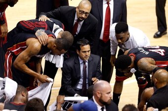 INDIANAPOLIS, IN - MAY 28: Erik Spoelstra of the Miami Heat speaks to his team in a huddle against the Indiana Pacers during Game Five of the Eastern Conference Finals of the 2014 NBA Playoffs at Bankers Life Fieldhouse on May 28, 2014 in Indianapolis, In
