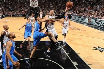 SAN ANTONIO,TX - MAY 29: Danny Green #4 of the San Antonio Spurs goes up for the layup against the Oklahoma City Thunder in Game Five of the Western Conference Finals during the 2014 NBA Playoffs on May 29, 2014 at the AT&T Center in San Antonio, Texas.  
