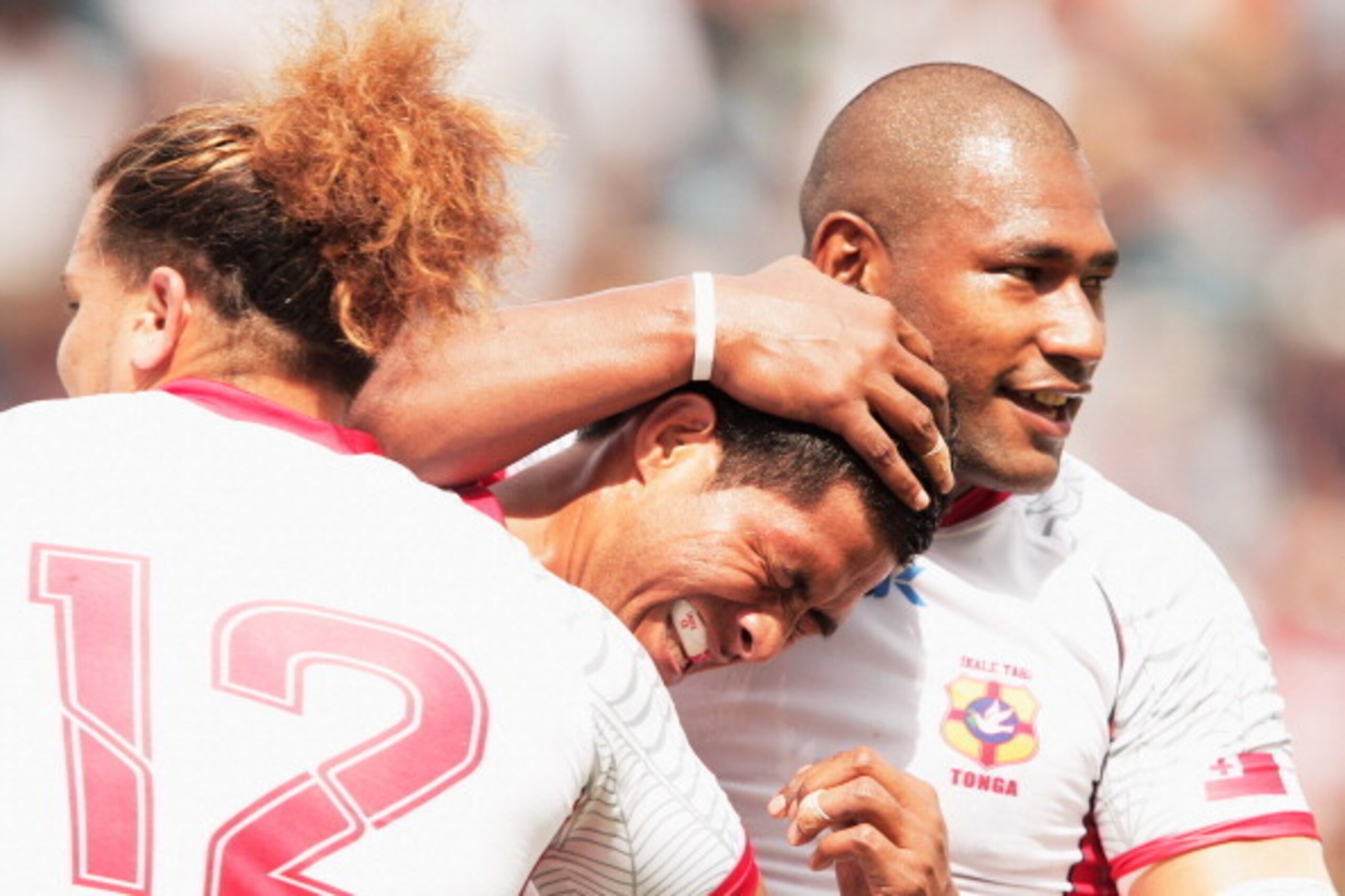 TOKYO, JAPAN - JUNE 10:  Alipate Fatafehi of Tonga is congratulated after scoring a try during the IRB Pacific Nations Cup match between Japan and Tonga at Prince Chichibu Memorial Stadium on June 10, 2012 in Tokyo, Japan.  (Photo by Adam Pretty/Getty Ima