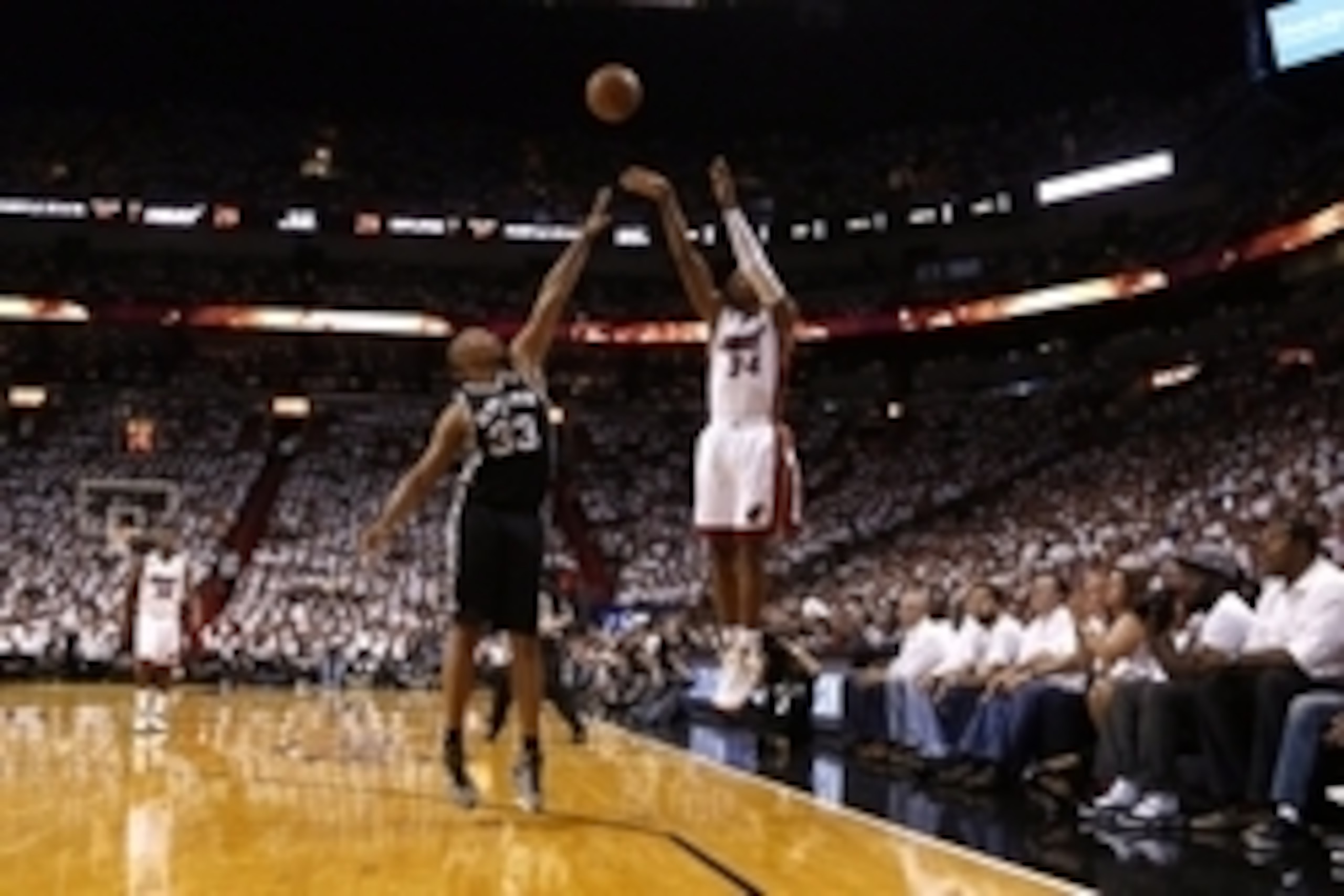 Jun 9, 2013; Miami, FL, USA;  Miami Heat shooting guard Ray Allen (34) shoots against San Antonio Spurs center Boris Diaw (33) during the second quarter of game two of the 2013 NBA Finals at the American Airlines Arena. Mandatory Credit: Derick E. Hingle-