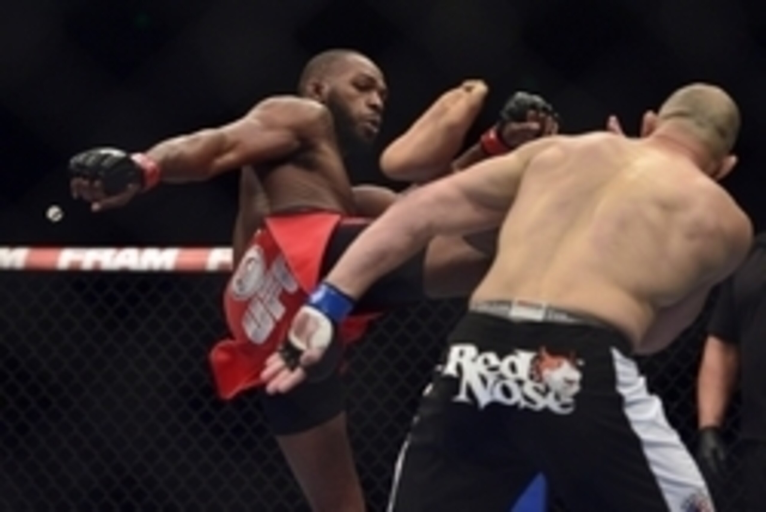 Apr 26, 2014; Baltimore, MD, USA;  Jon Jones kicks Glover Teixeira in the head during the UFC light heavy weight championship fight at  Baltimore Arena. Jones retained the light heavy height championship by defeating  Teixeria.  Mandatory Credit: Tommy Gi
