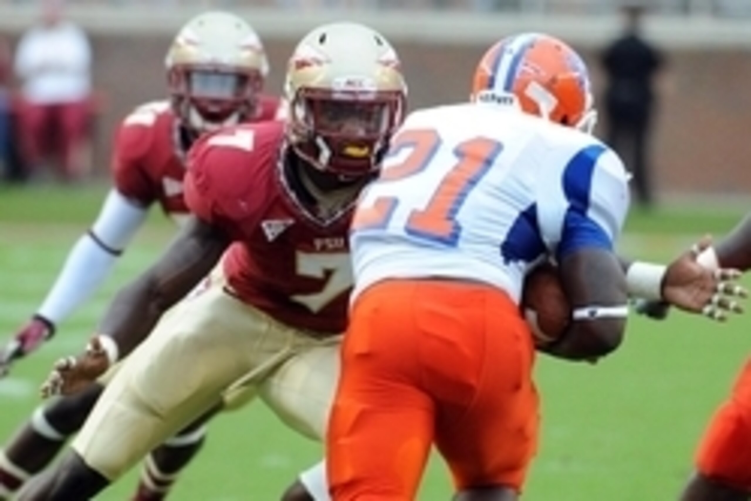 Sept 8, 2012;  Tallahassee, Florida, USA; Florida State Seminoles linebacker Christian Jones (7) prepares to tackle Savannah State Tigers running back Sheldon Barnes (21) during the first half of the game at Doak Campbell Stadium. Mandatory Credit: Melina