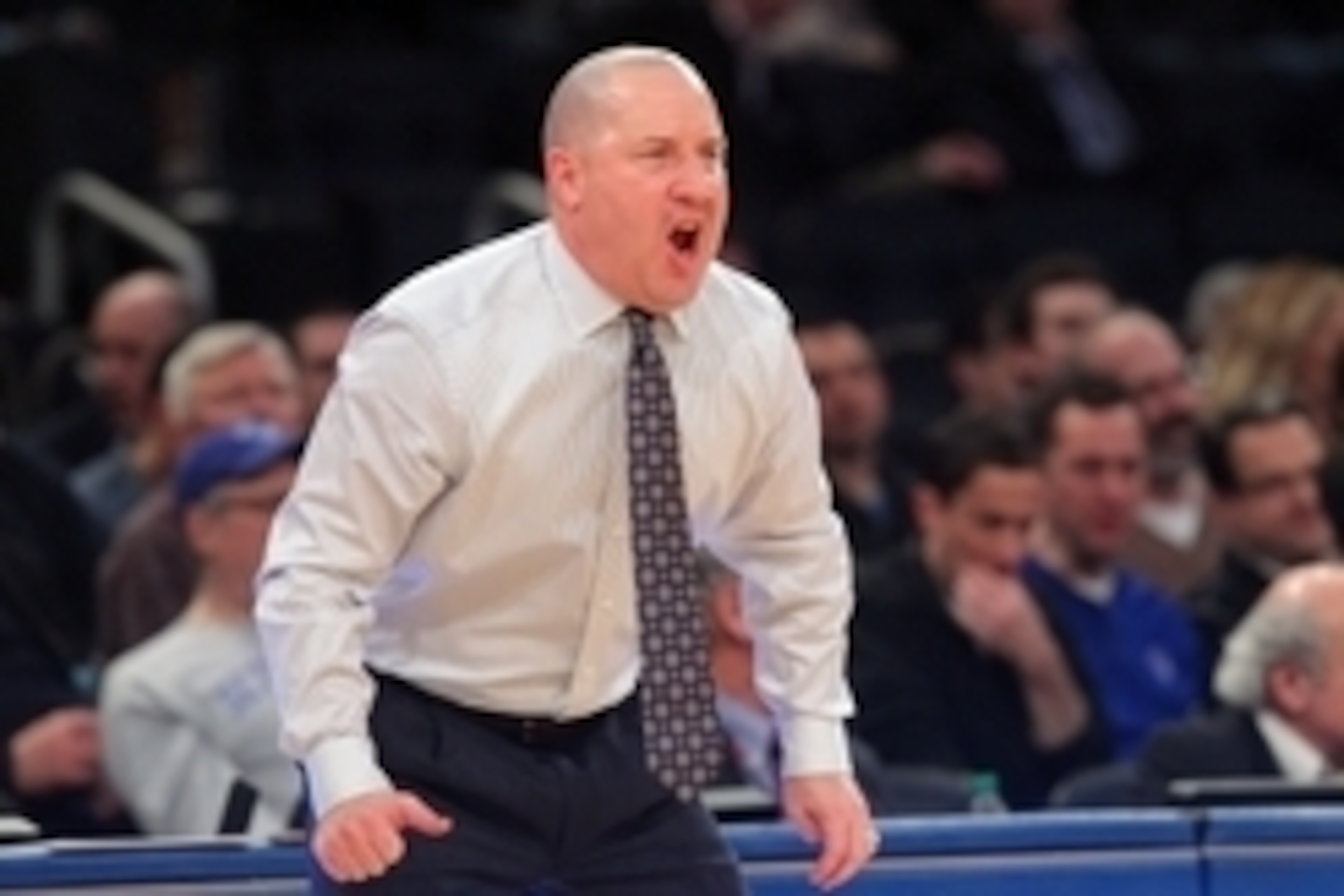 Mar 13, 2014; New York, NY, USA; Marquette Golden Eagles head coach Buzz Williams coaches against the Xavier Musketeers during the first half of a game in the second round of the Big East college basketball tournament at Madison Square Garden. Mandatory C