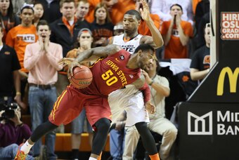 Feb 3, 2014; Stillwater, OK, USA; Iowa State Cyclones guard DeAndre Kane (50) attempts to get around Oklahoma State Cowboys guard Marcus Smart (33) at Gallagher-Iba Arena. Iowa State defeated Oklahoma State 98-97 in triple overtime. Mandatory Credit: Nels