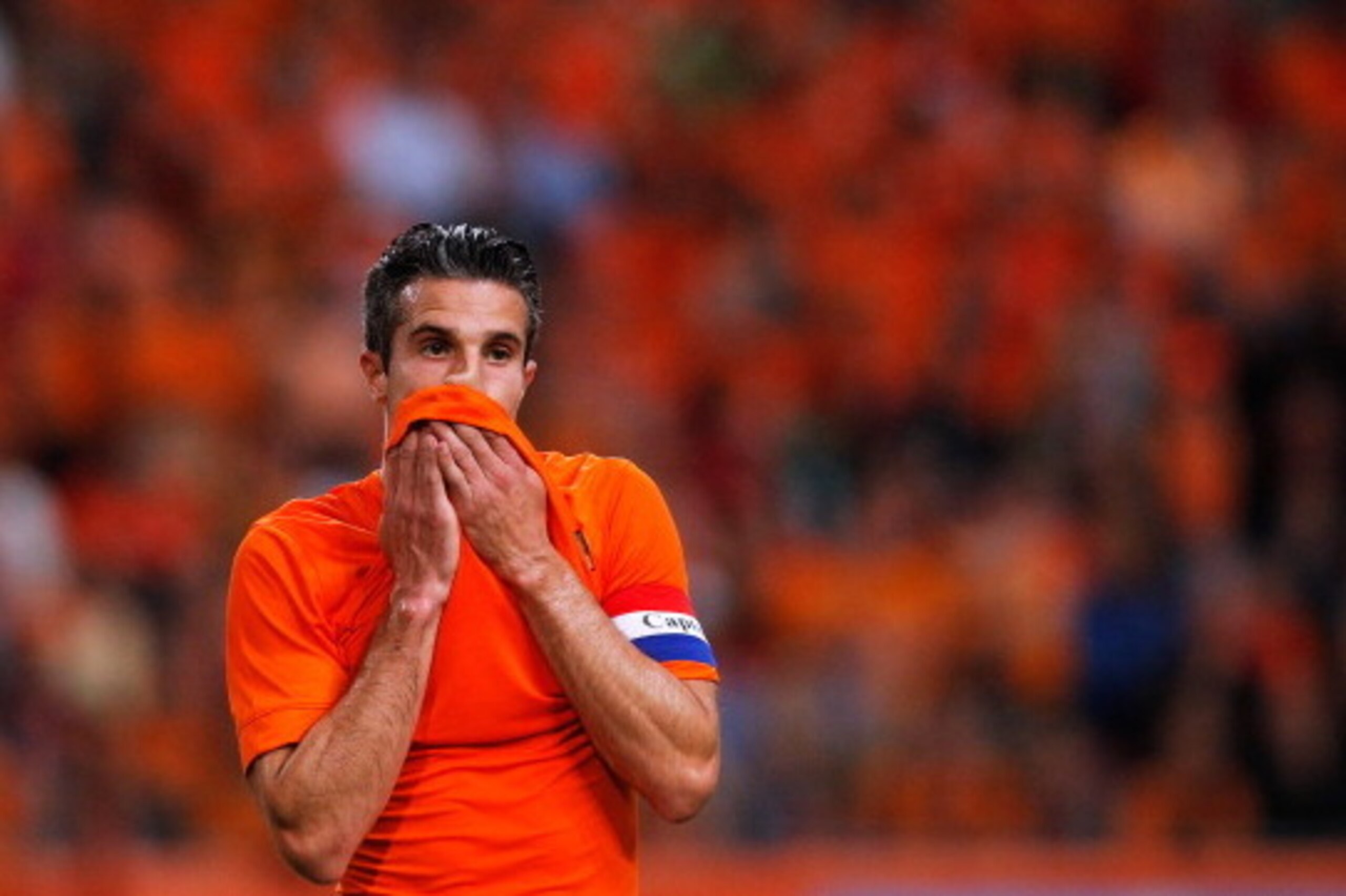 AMSTERDAM, NETHERLANDS - JUNE 04:  Robin Van Persie of Netherlands wipes his face during the International Friendly match between The Netherlands and Wales at Amsterdam Arena on June 4, 2014 in Amsterdam, Netherlands.  (Photo by Dean Mouhtaropoulos/Getty 