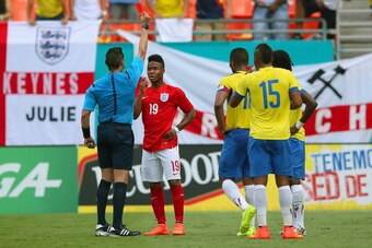 MIAMI GARDENS, FL - JUNE 04:  The referee shows Raheem Sterling of England a red card during the International friendly match between England and Ecuador at Sun Life Stadium on June 4, 2014 in Miami Gardens, Florida.  (Photo by Richard Heathcote/Getty Ima