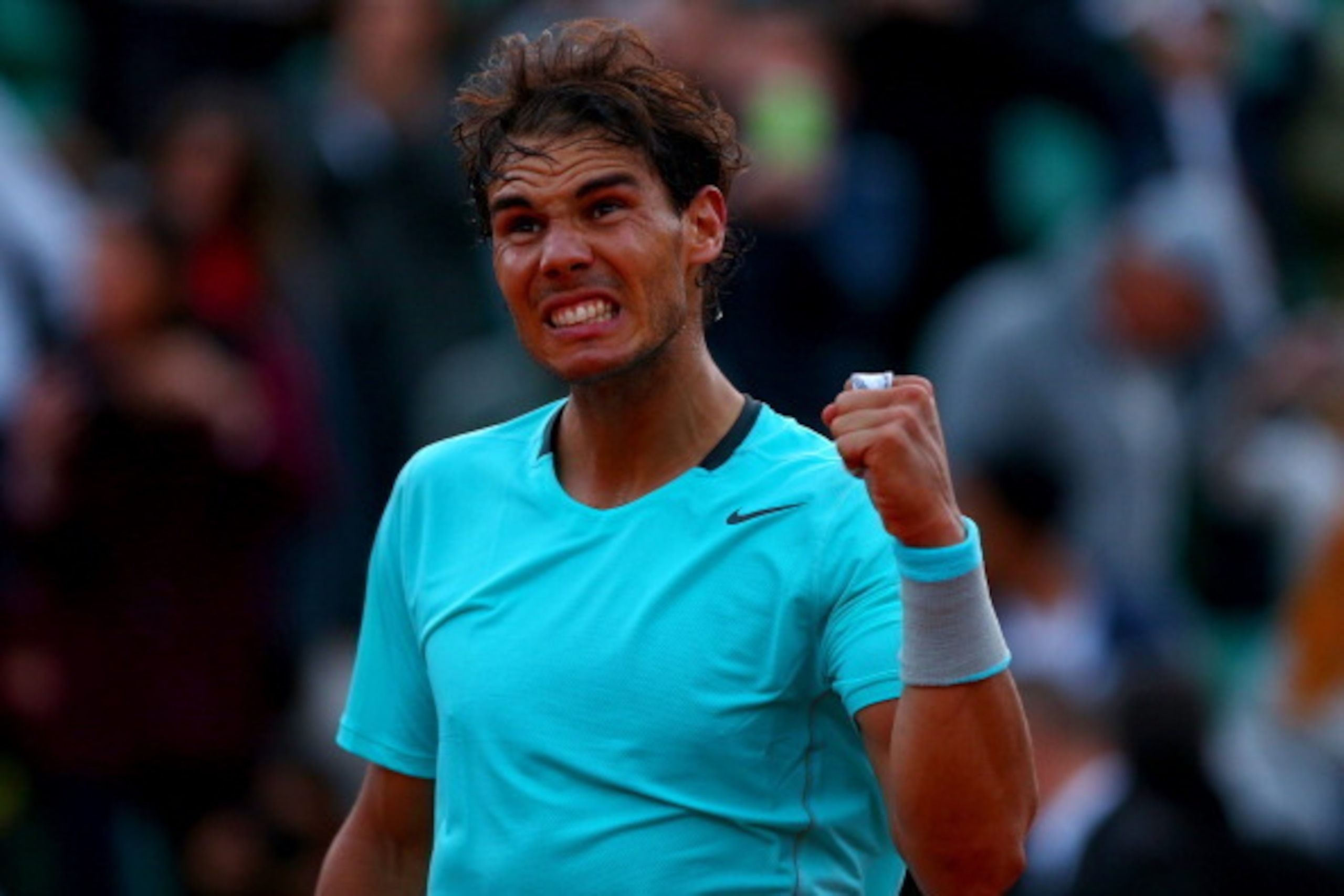PARIS, FRANCE - JUNE 04:  Rafael Nadal of Spain celebrates victory in his men's singles quarter-final match against David Ferrer of Spain on day eleven of the French Open at Roland Garros on June 4, 2014 in Paris, France.  (Photo by Dan Istitene/Getty Ima