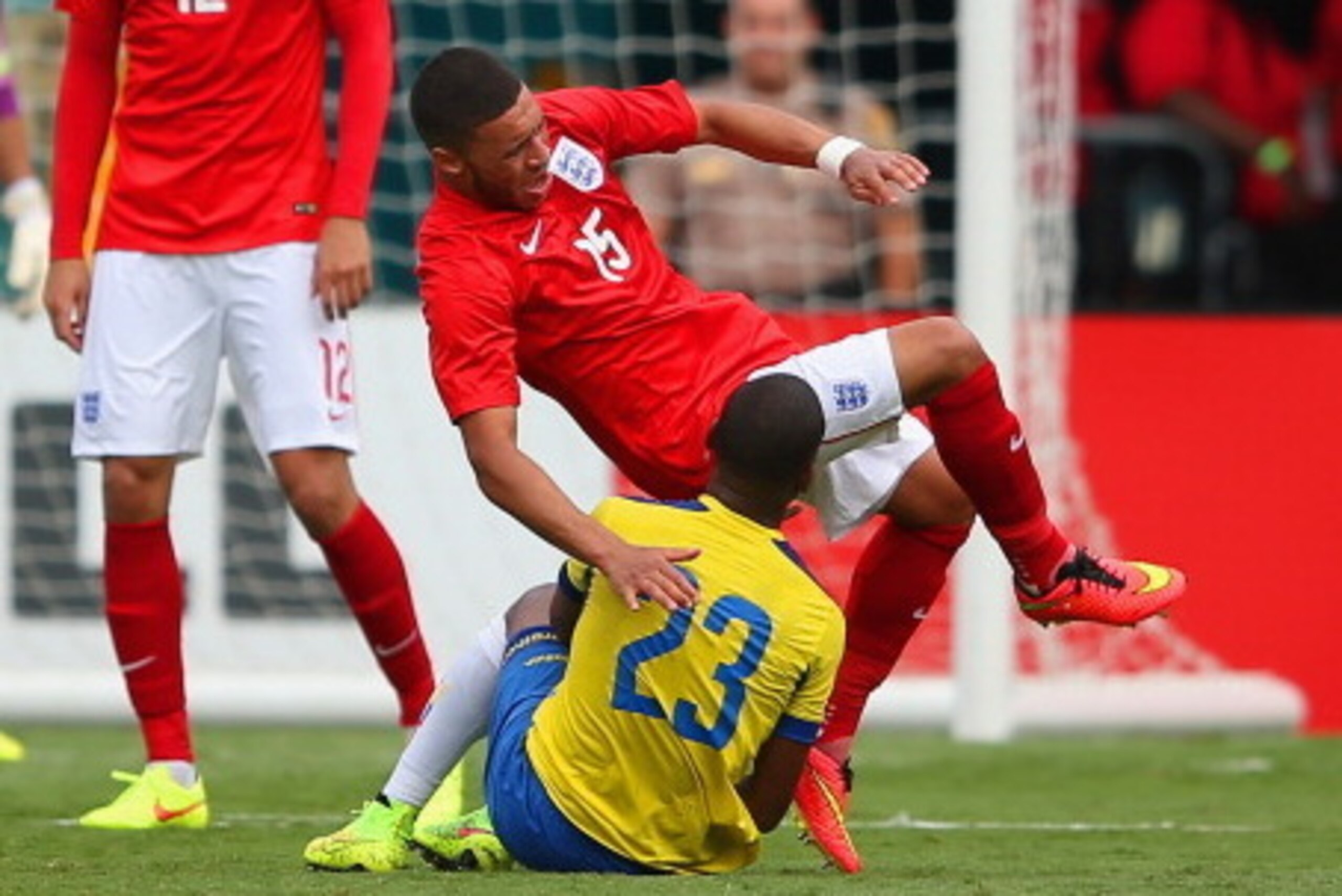 MIAMI GARDENS, FL - JUNE 04:  Carlos Gruezo of Ecuador brings down Alex Oxlade-Chamberlain of England during the International friendly match between England and Ecuador at Sun Life Stadium on June 4, 2014 in Miami Gardens, Florida.  (Photo by Richard Hea